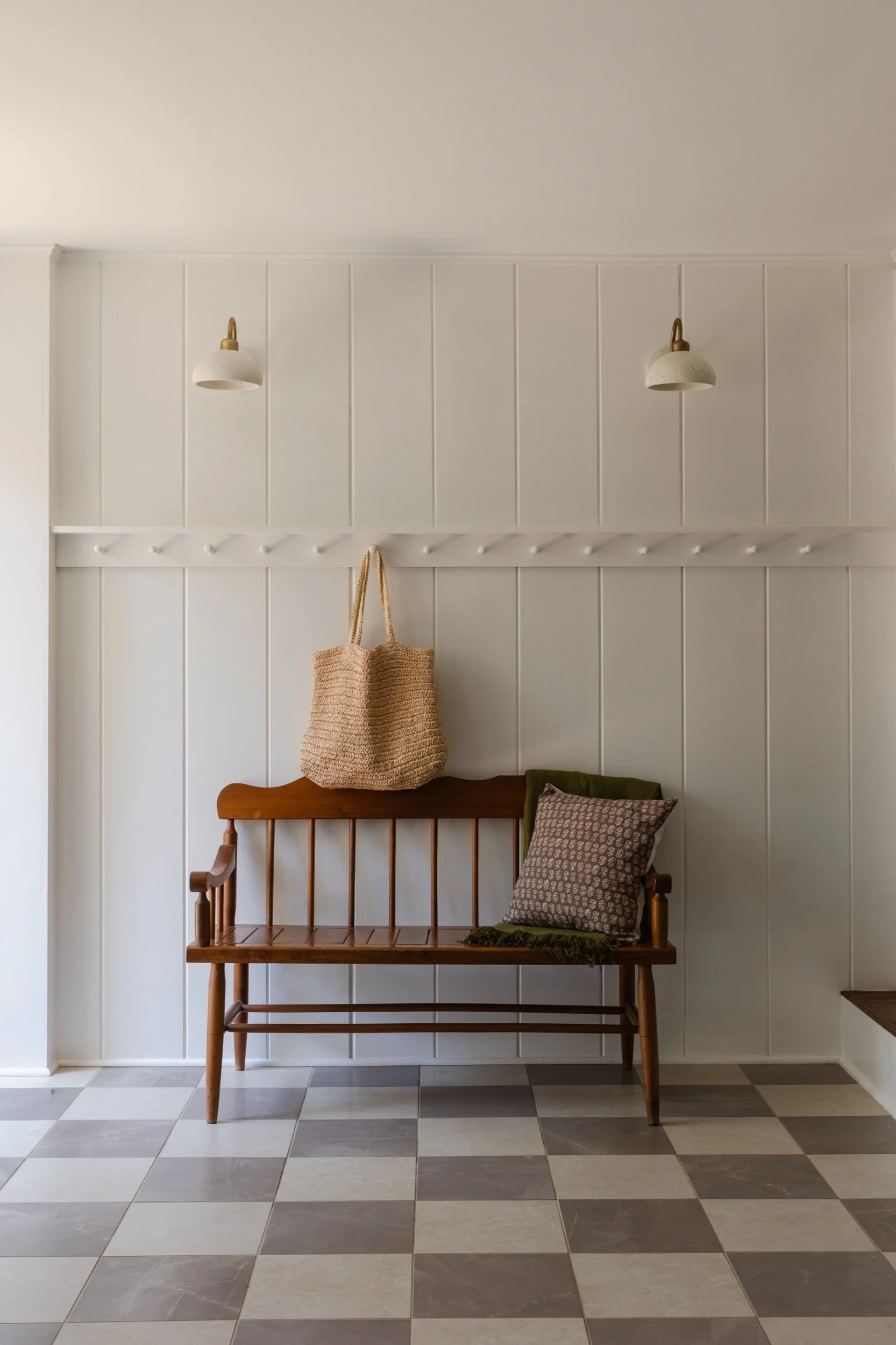 Mudroom bench and checkerboard floor