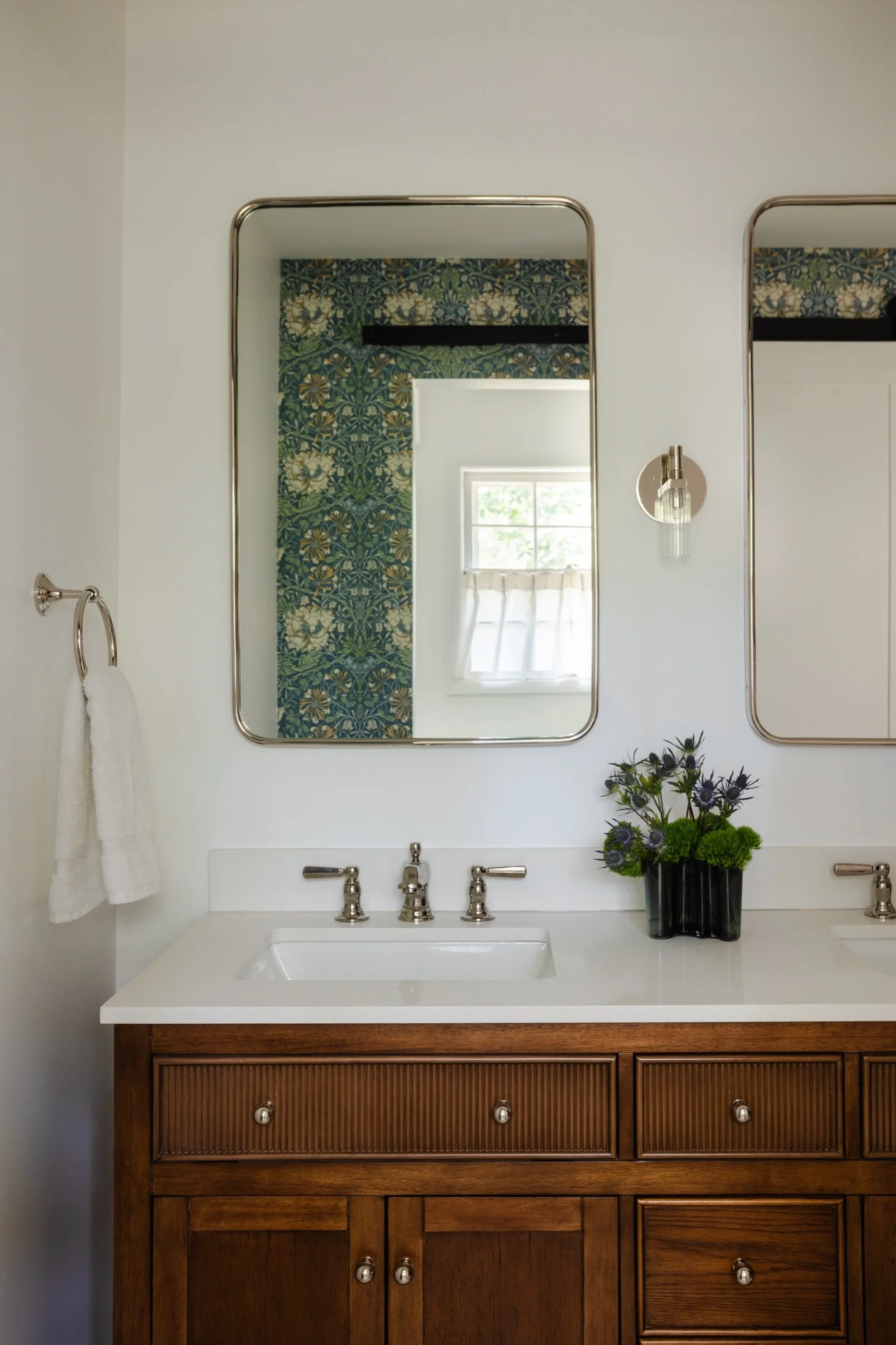Vanity with patterned wallpaper