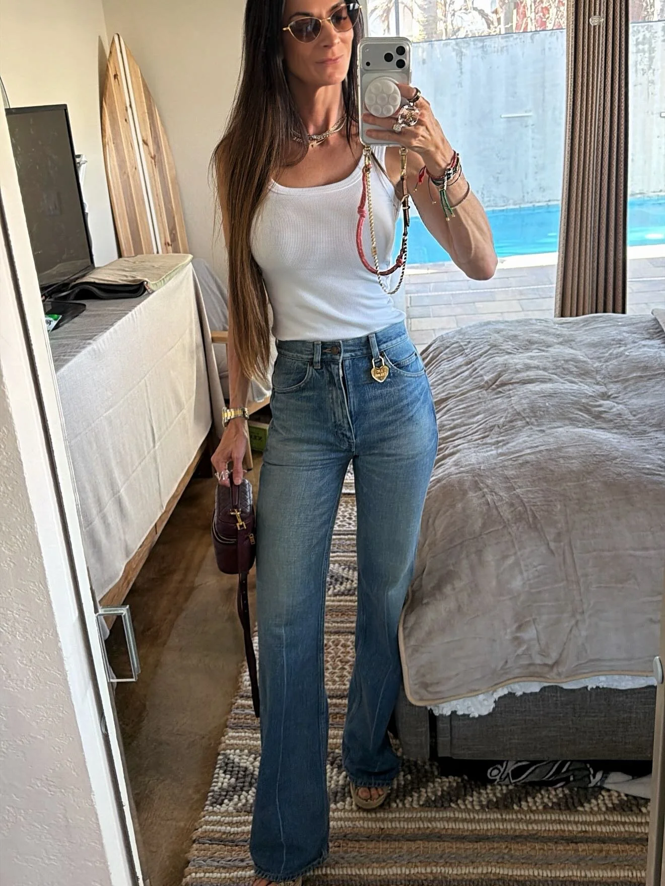 Basic&hellip; but make it designer 💅✨

Viral denim, a simple white tank, and a little extra on the details&mdash;because it&rsquo;s always the accessories that do the talking.

This tiny charm? Yeah&hellip; she understood the assignment 😉 

Effortl