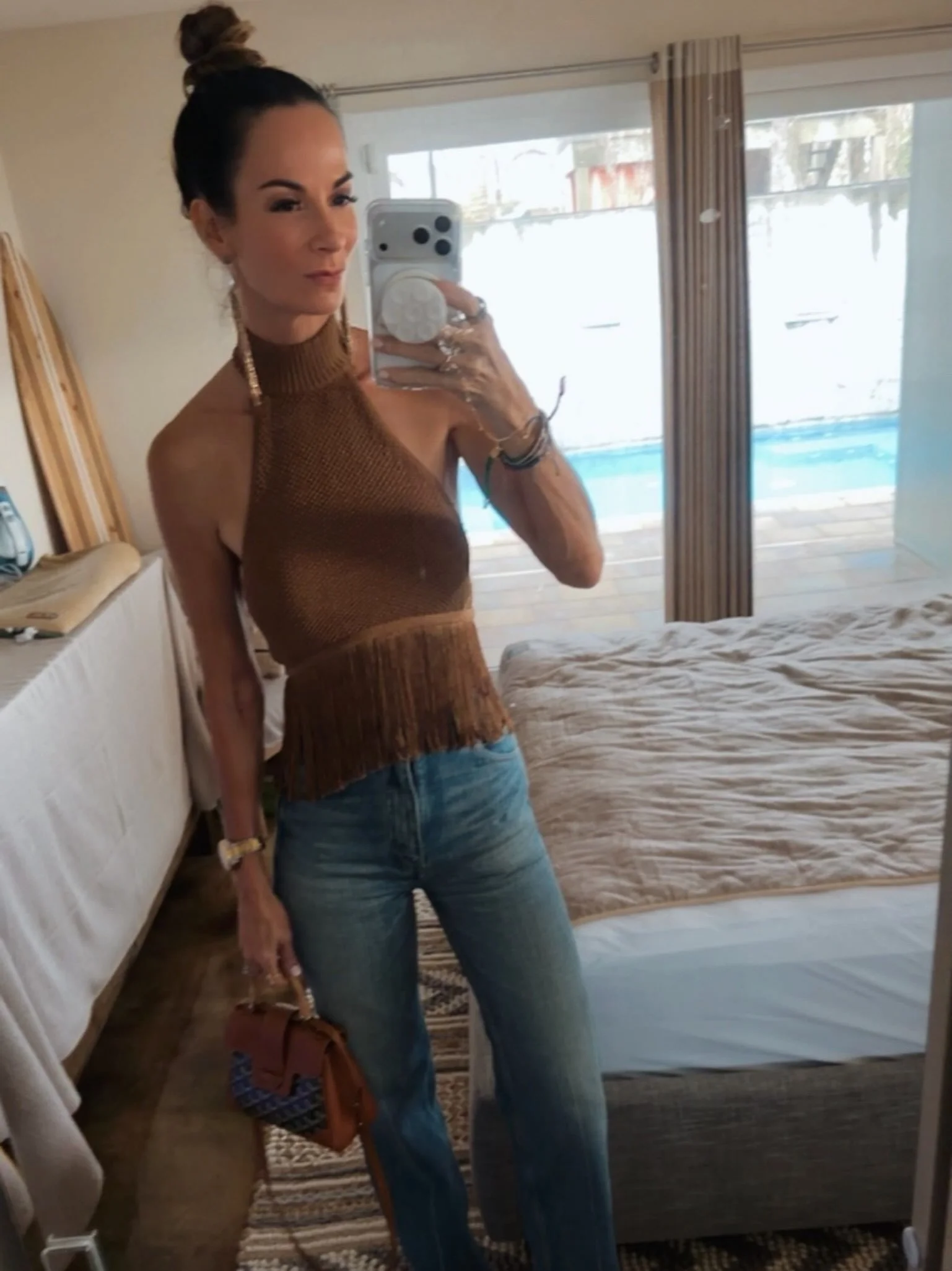 Last night&rsquo;s look brought a little &rsquo;70s sass&mdash;and I am here for every bit of it. 🤎✨

Saint Laurent jeans, sky-high Chlo&eacute; platforms, a fringe top that understood the assignment, and my Goyard bag to finish it off. Because if t