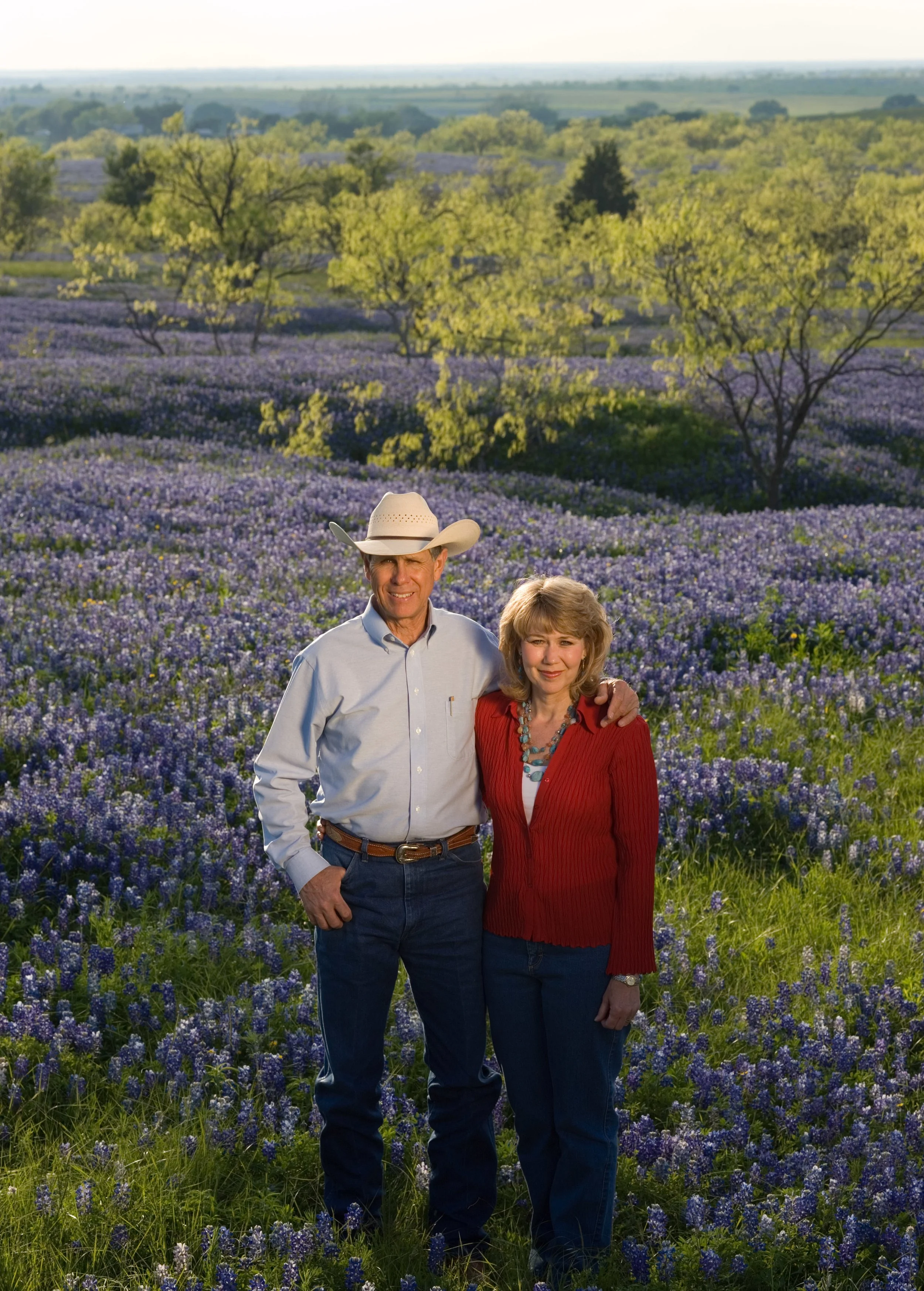 Gary and Sue Price in a field of bluebonnets.