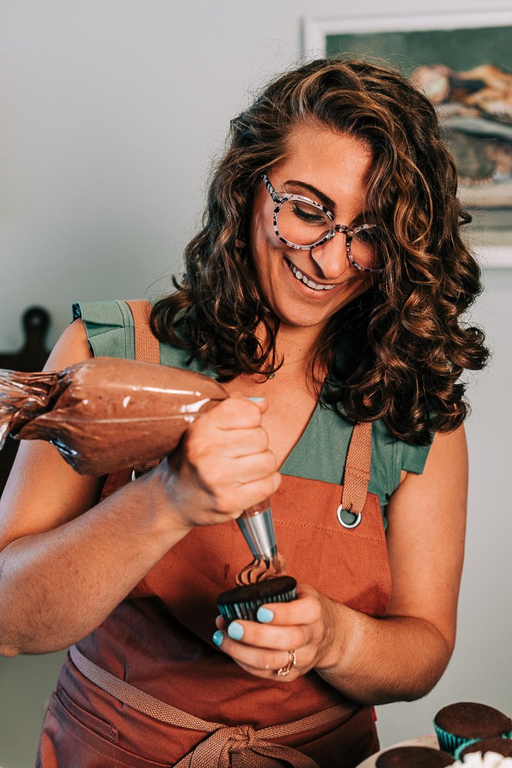 Woman-icing-chocolate-cupcake.jpg