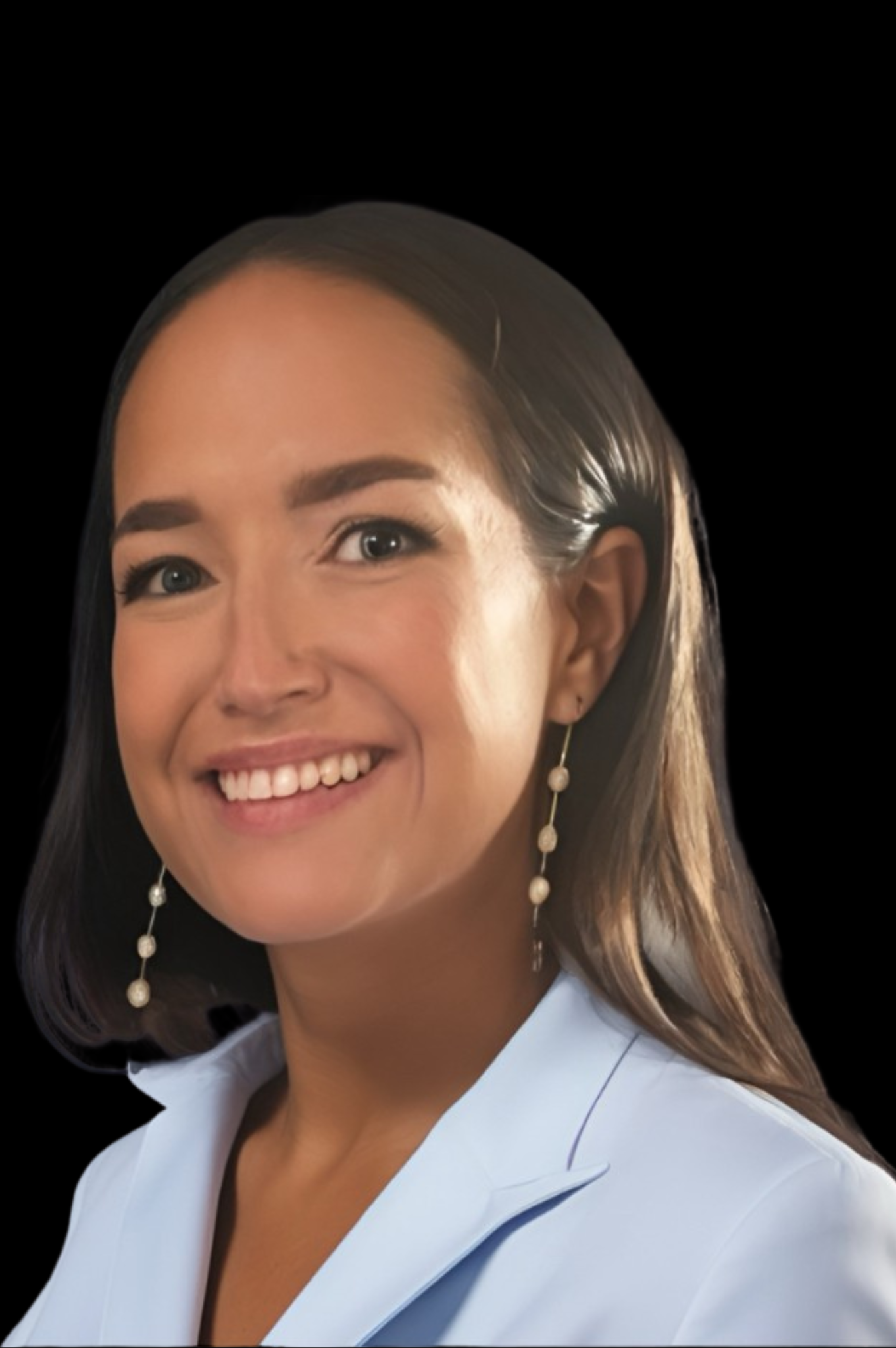 Smiling person with long dark hair, wearing a blue shirt against a black background.