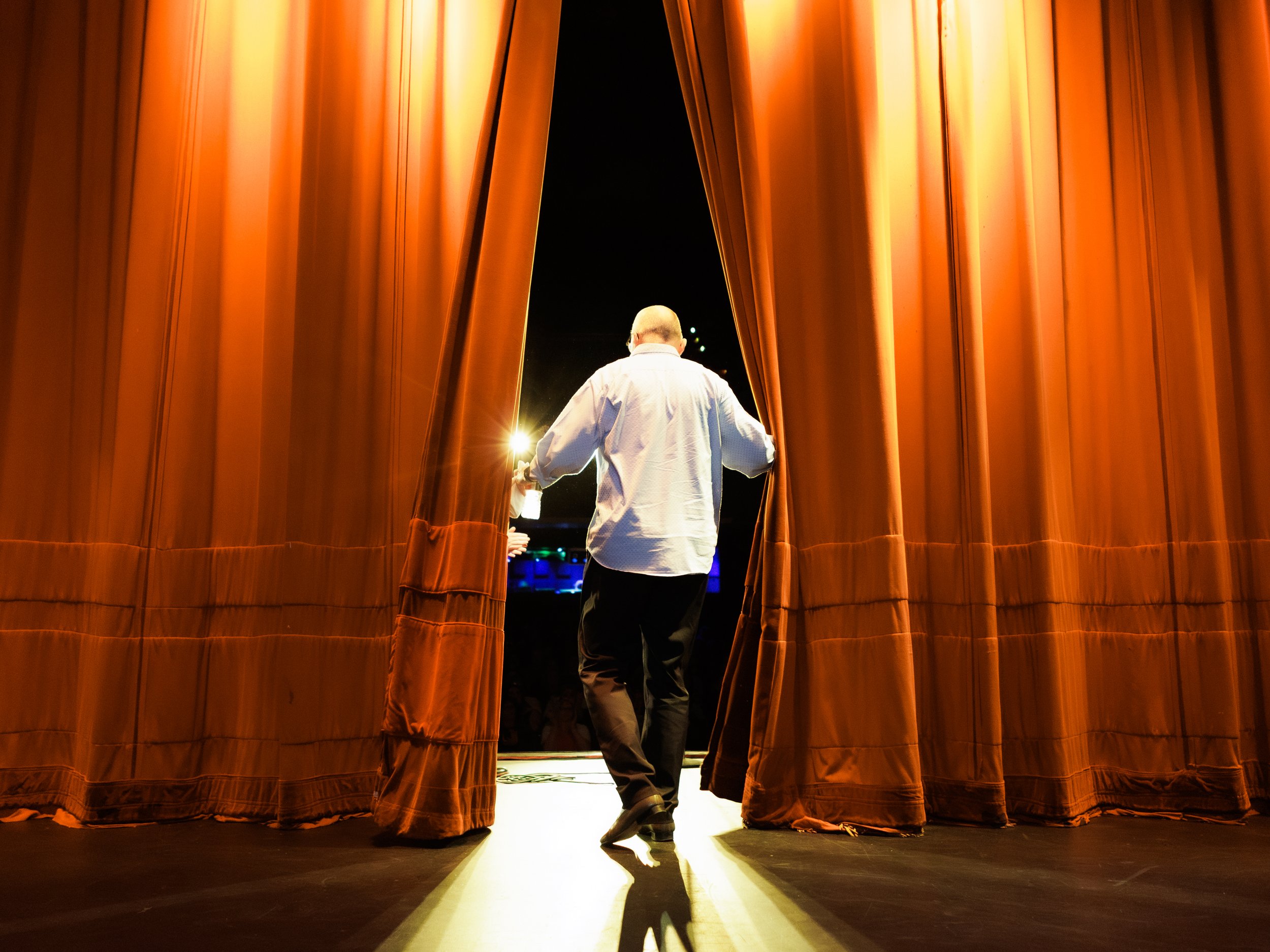 Brad Upton Walks out on stage at the Everett Theater