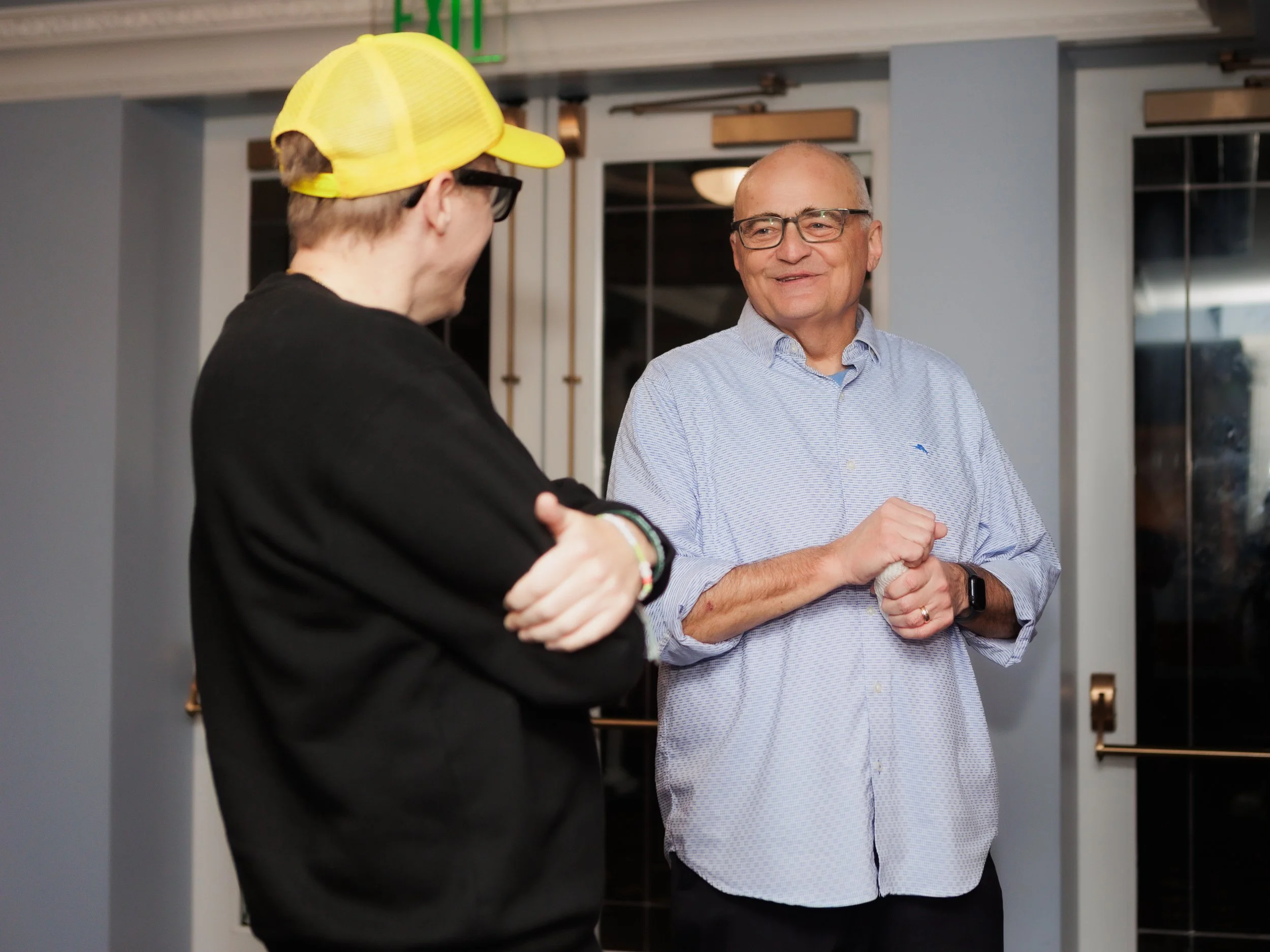 Andrew Rivers and Brad Upton talking in the lobby at the Everett Historic Theater 