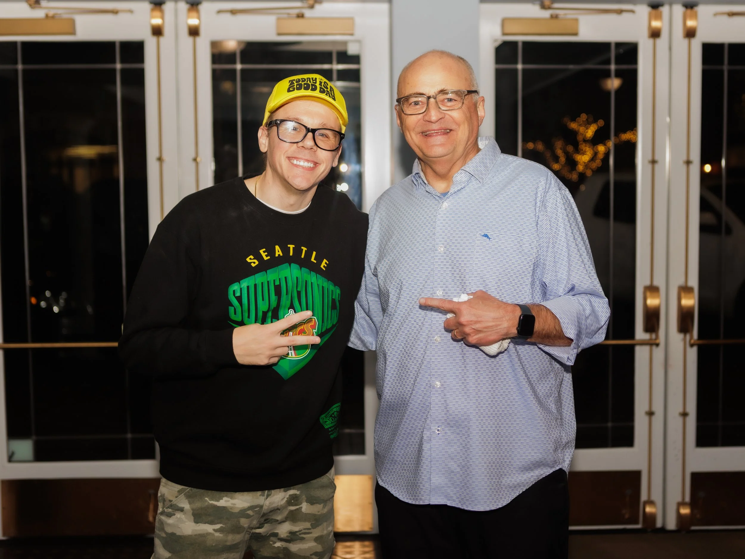 Andrew Rivers and Brad Upton talking in the lobby at the Everett Historic Theater 