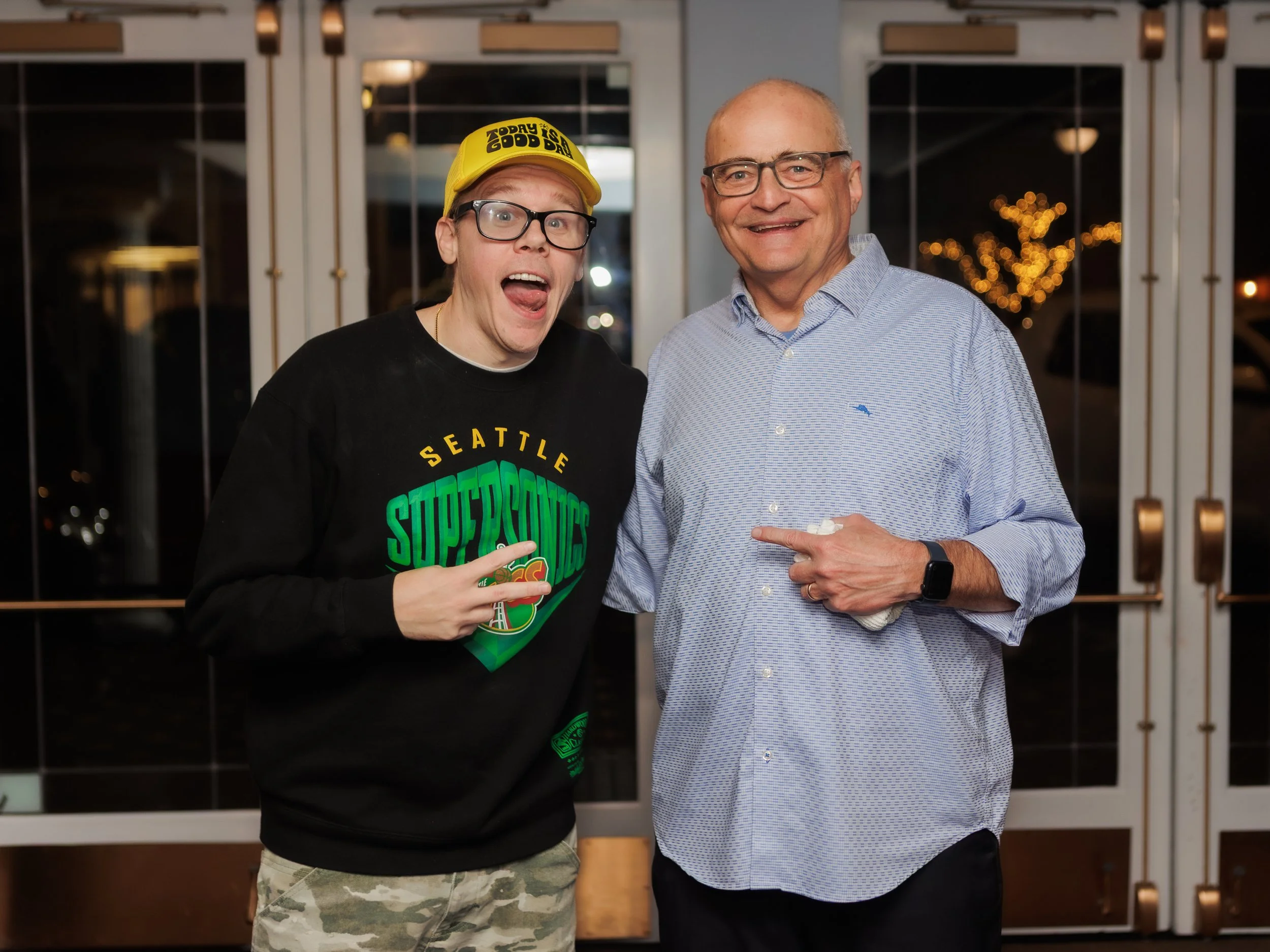 Andrew Rivers and Brad Upton talking in the lobby at the Everett Historic Theater 