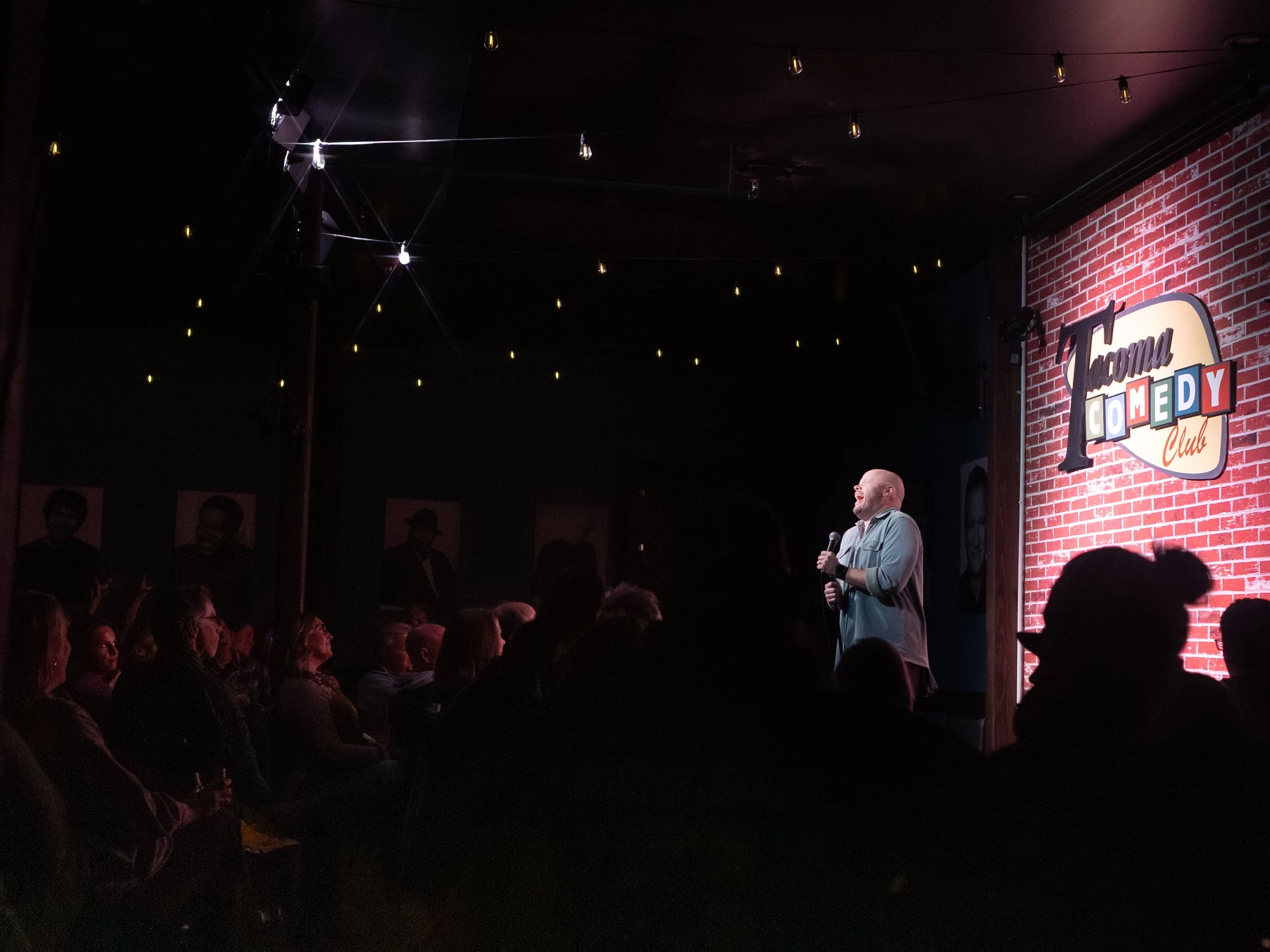 JR Berard, comedian, on stage, tacoma comedy club