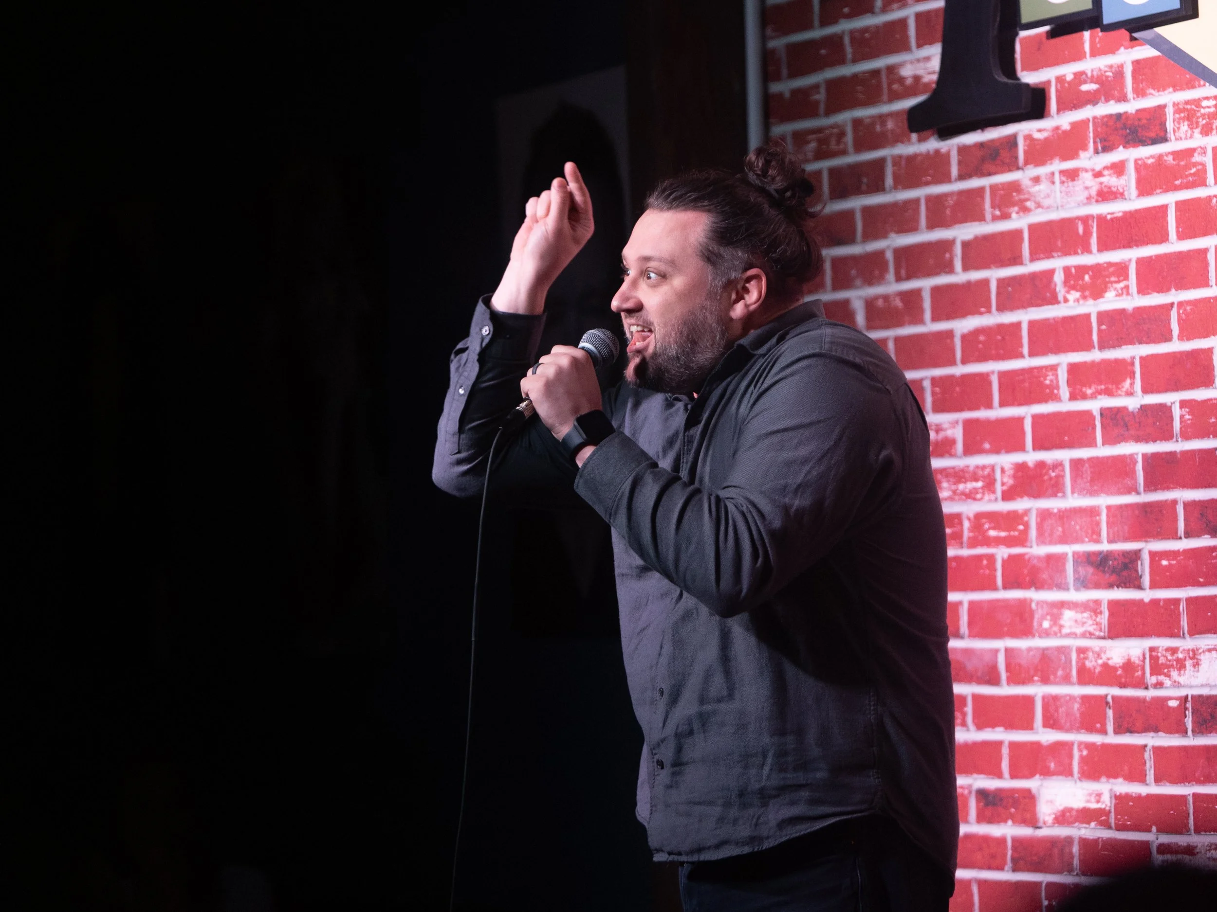 Mike Coletta, comedian, on stage, tacoma comedy club