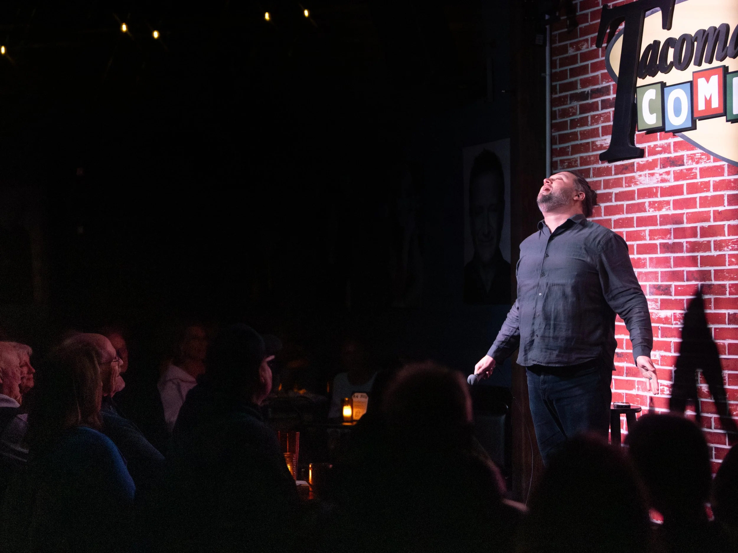 Mike Coletta, comedian, on stage, tacoma comedy club