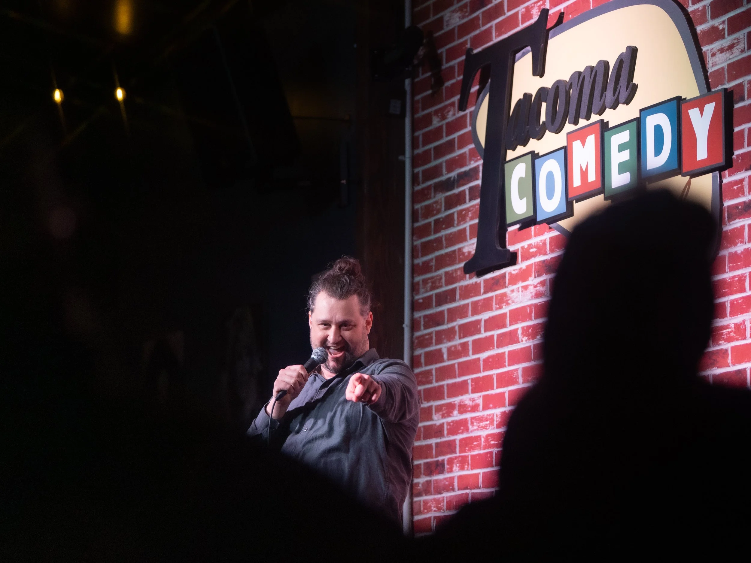 Mike Coletta, comedian, on stage, tacoma comedy club