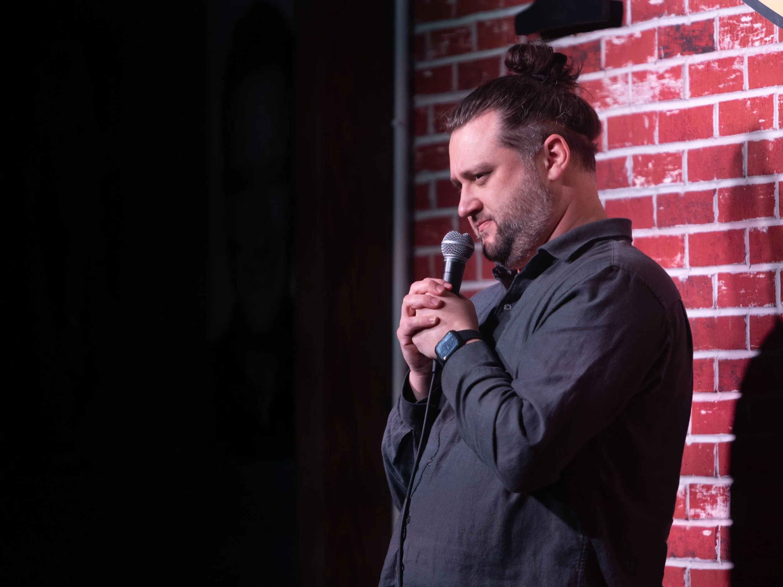 Mike Coletta, comedian, on stage, tacoma comedy club