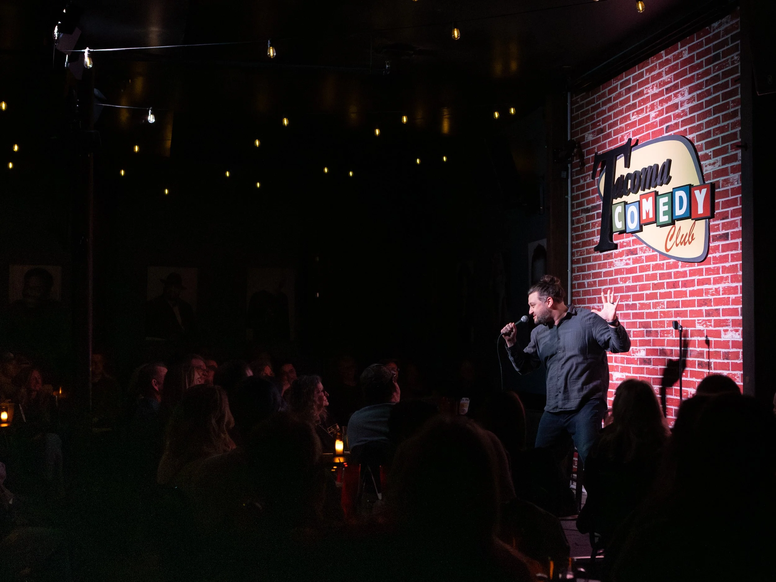 Mike Coletta, comedian, on stage, tacoma comedy club