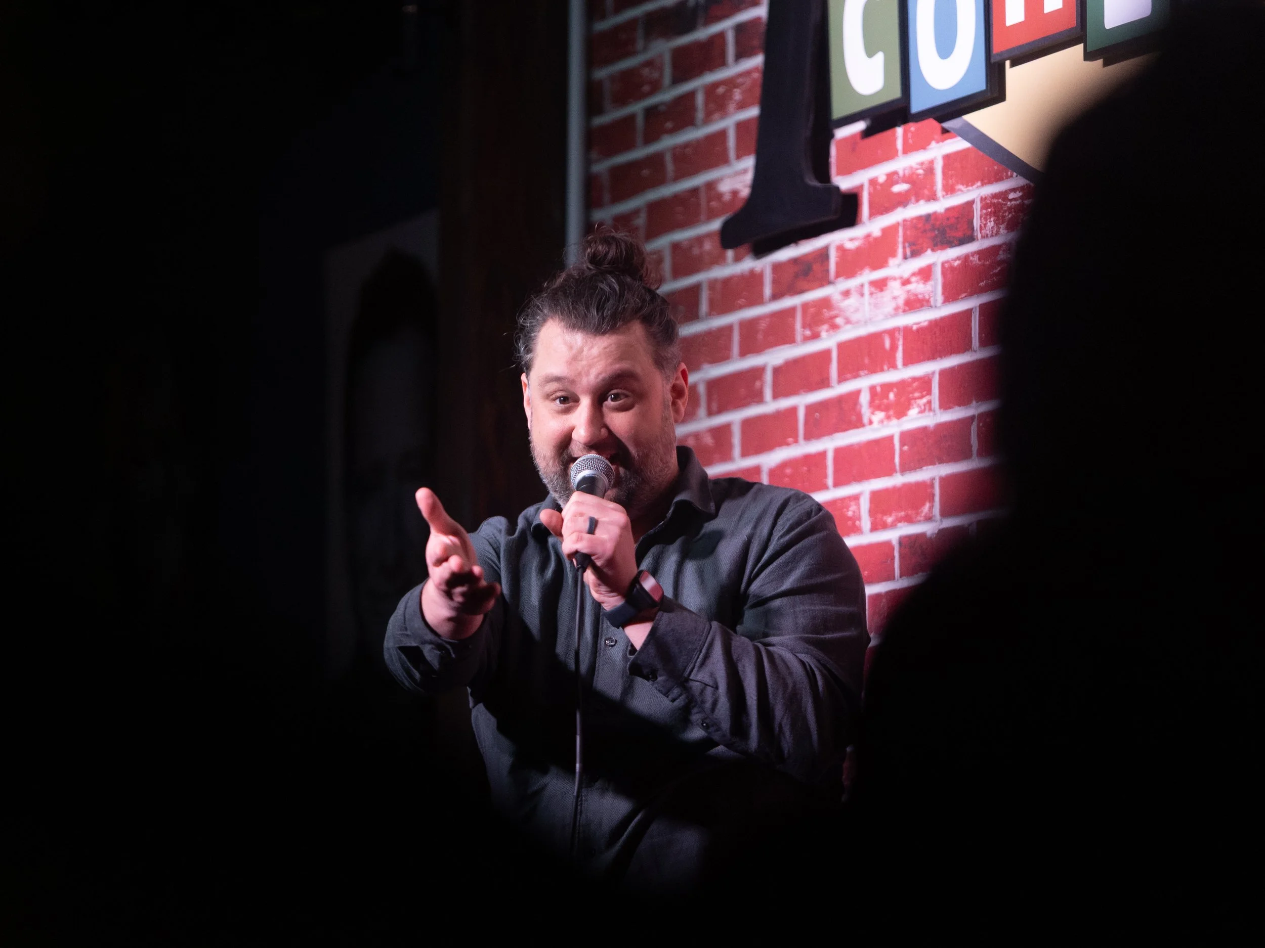 Mike Coletta, comedian, on stage, tacoma comedy club, 6th and proctor