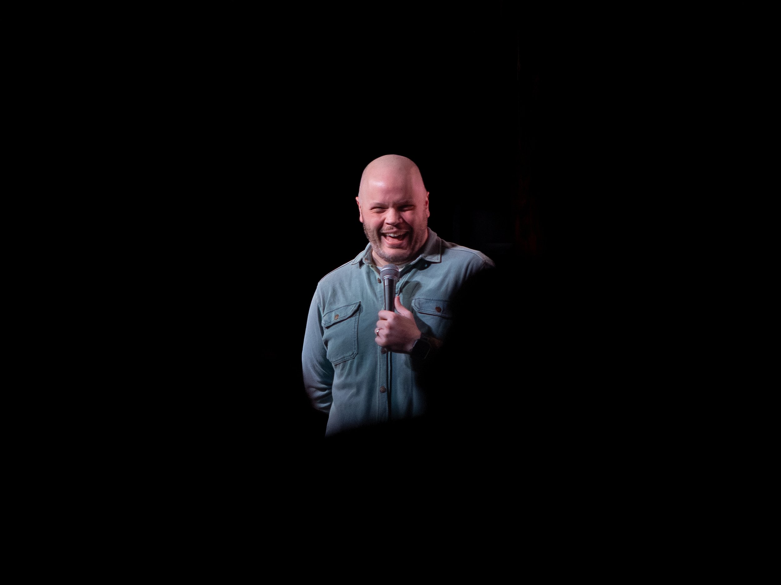 JR Berard, on stage, comedian, tacoma comedy club, 6th and proctor