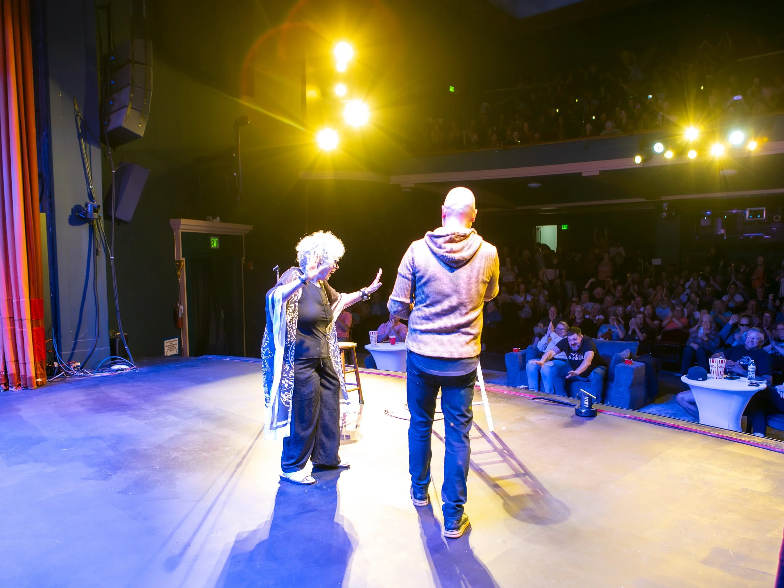 Star Search's Susan Rice dancing with cory michaelis on stage at the new everett theater headlining for everett comedy 