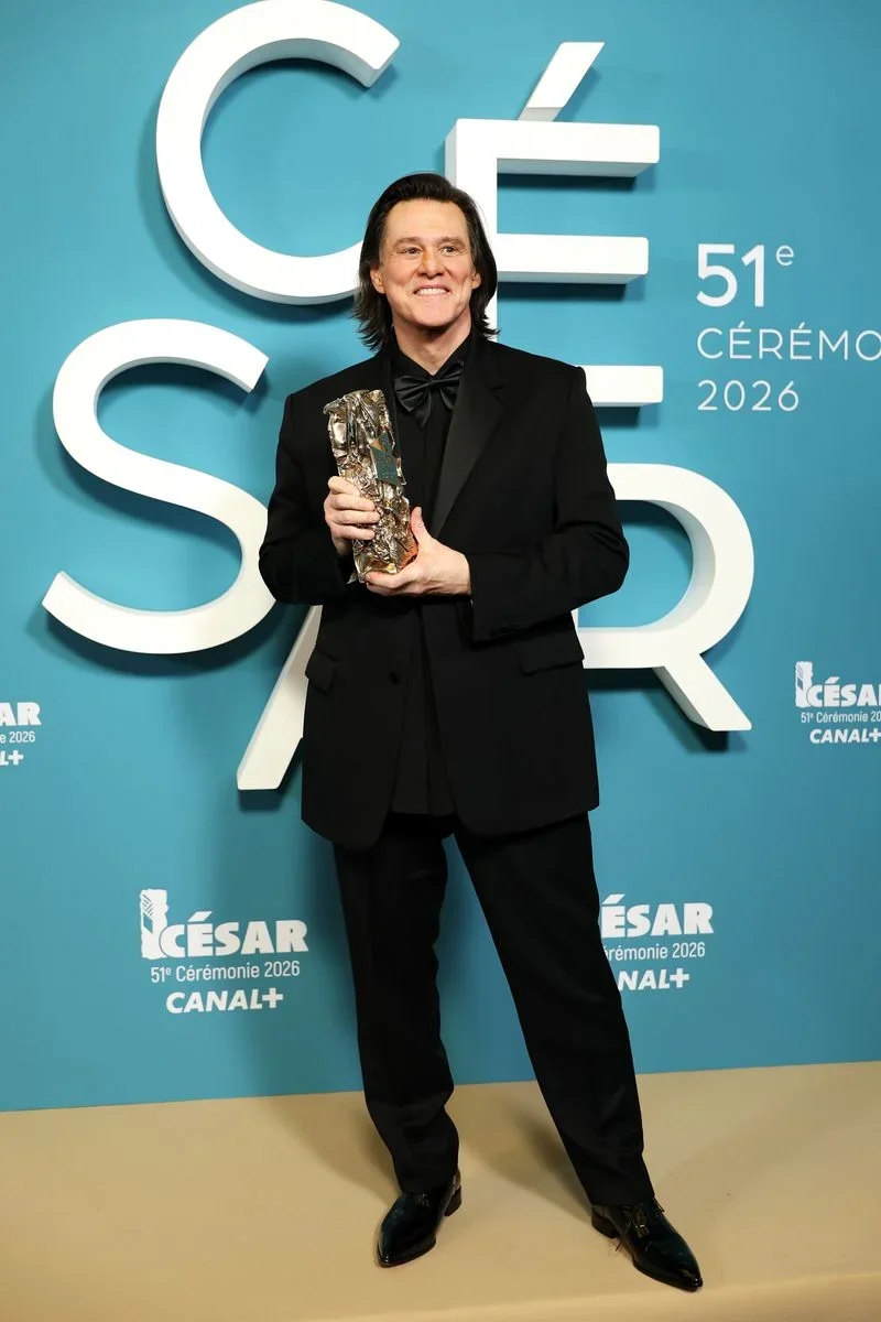 5b9b48b97144-paris-france-jim-carrey-poses-with-the-honorary-cesar-award-during-the-51st-cesa-1.webp