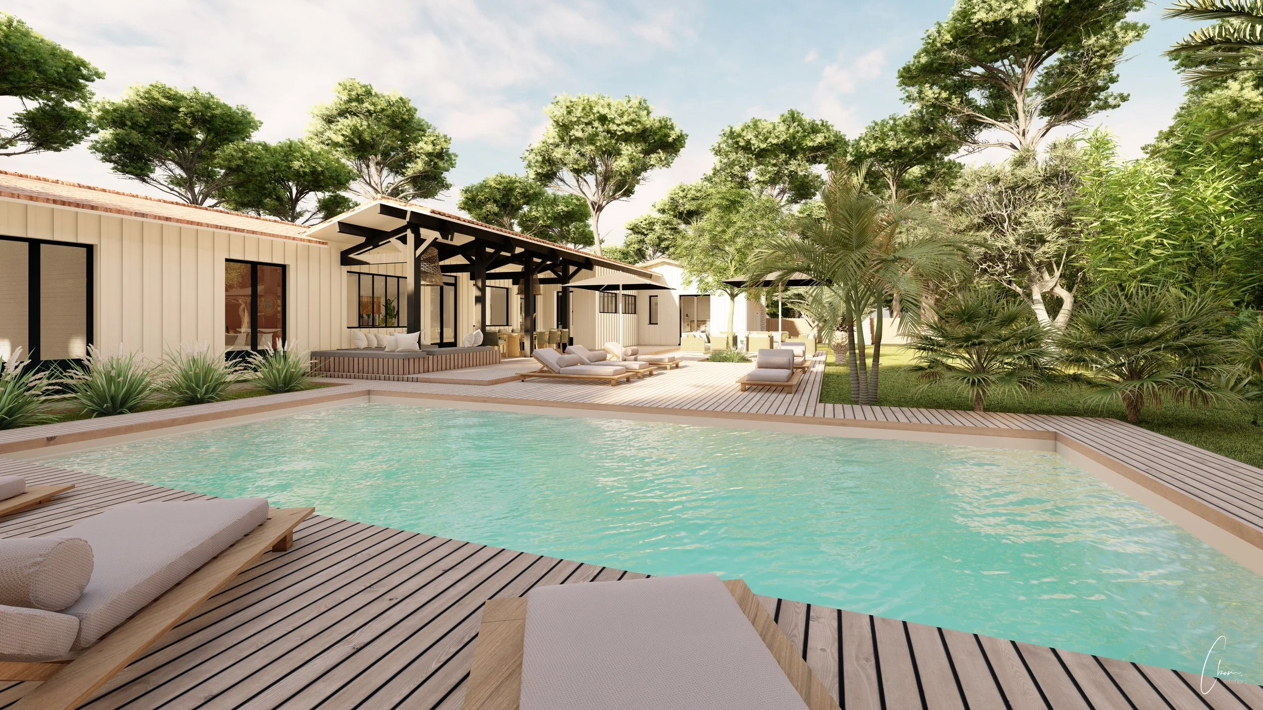 Pool area surrounded by pines and palm trees, outdoor design of a Cap Ferret villa