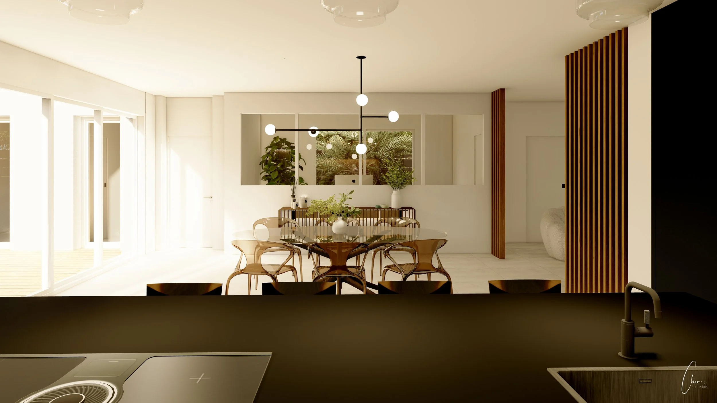 Cuisine centrale ouverte sur l'espace repas avec table en verre, architecture d'intérieur d'une maison à Andernos-les-Bains