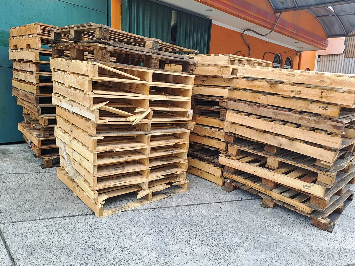 Stacks of used wooden pallets