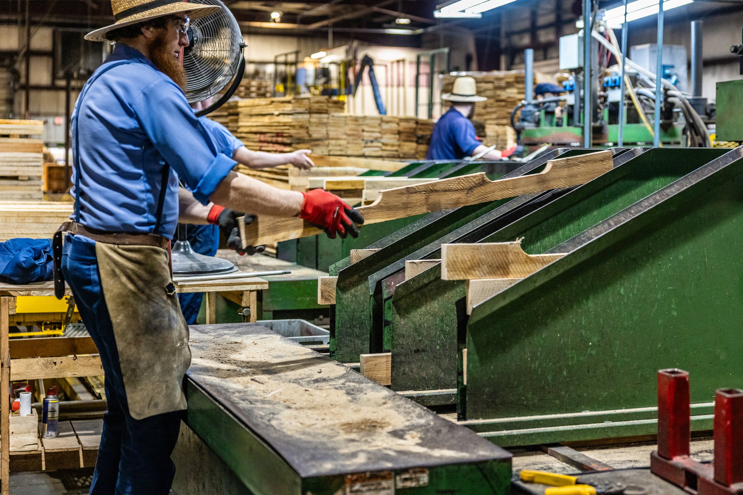 Olympic worker making Raggle sticks in the factory