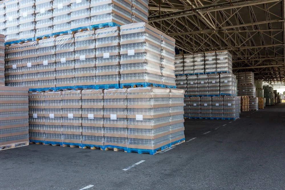 floor-stacked products on wooden pallets in a warehouse