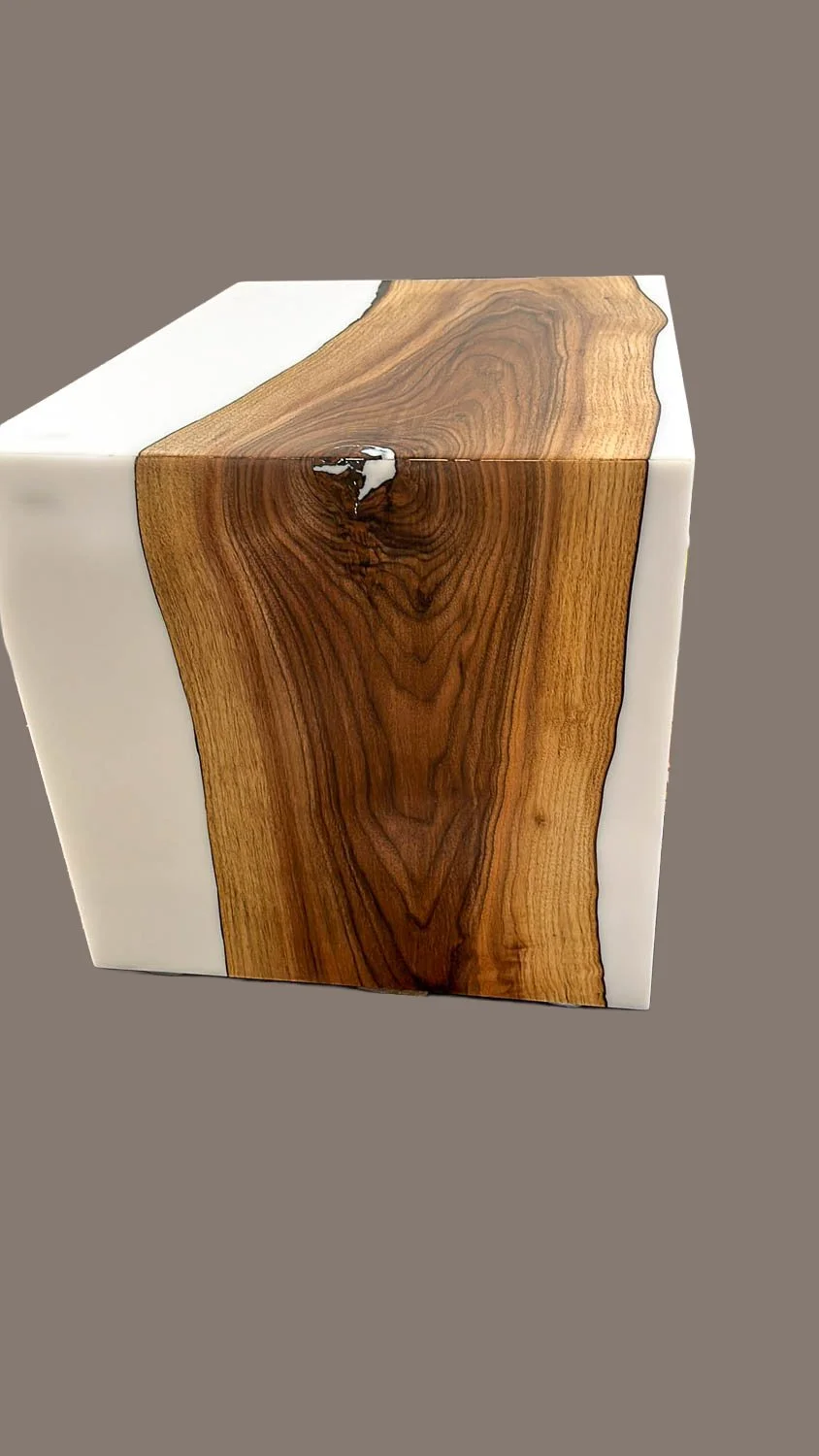A decorative square wooden and white resin table or piece of furniture with a natural wood grain pattern and a glossy finish.