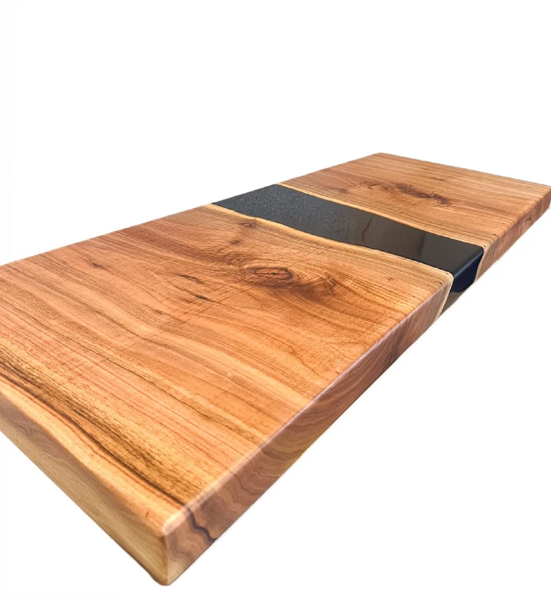 A wooden tabletop with a black resin inlay running through the center.