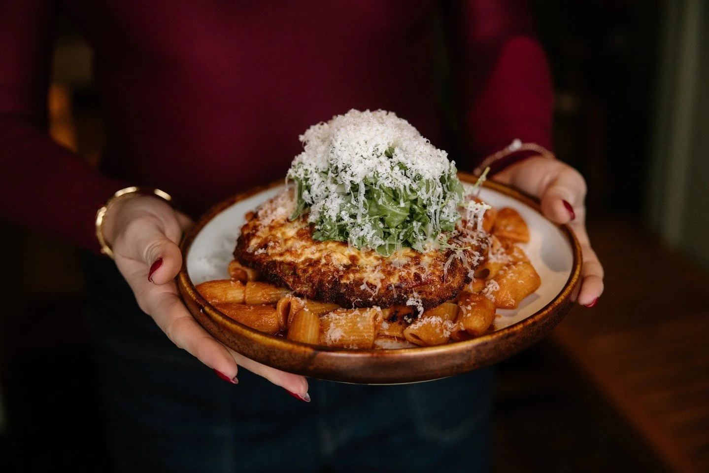 Nothing says long weekend quite like Chicken Parmesan and a lingering dinner.⁠
⁠
Breaded + fried chicken parmesan topped with mozzarella, arugula, and grana padano, served alongside rigatoni pomodoro because going home hungry feels deeply un-Italian.