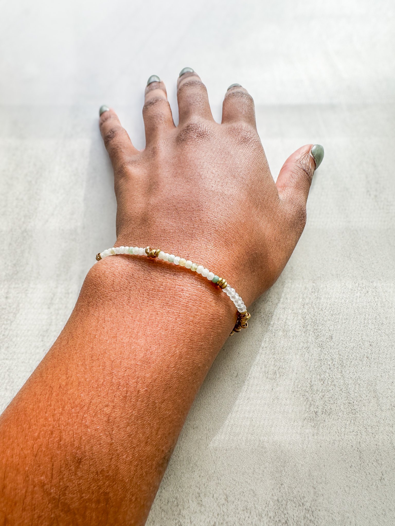 Eden natural gemstone bracelet on wrist with Burmese jade, rainbow moonstone and watermelon tourmaline