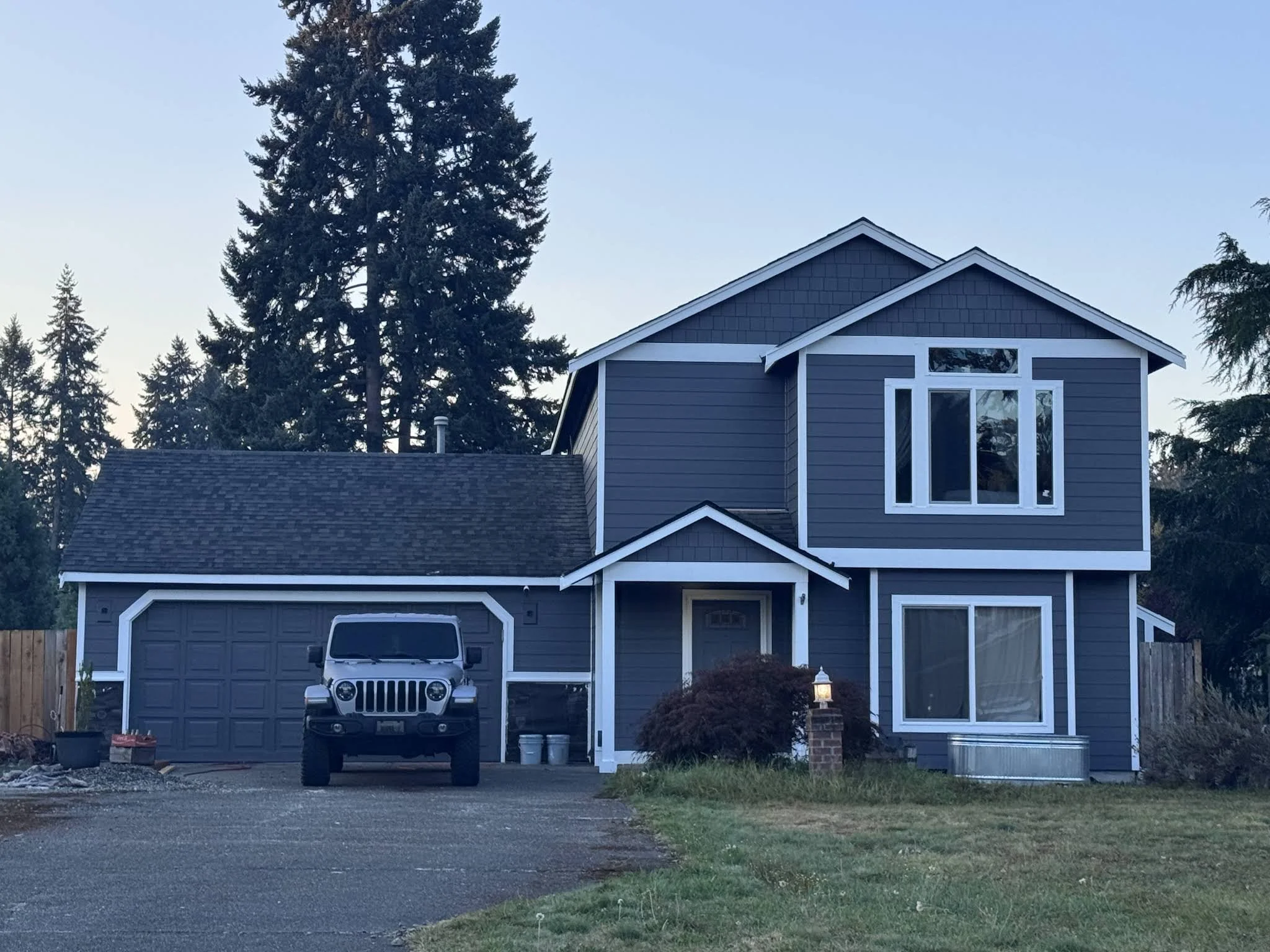 Dark gray siding completed by Rusev Builders — customer photo by William McGuire