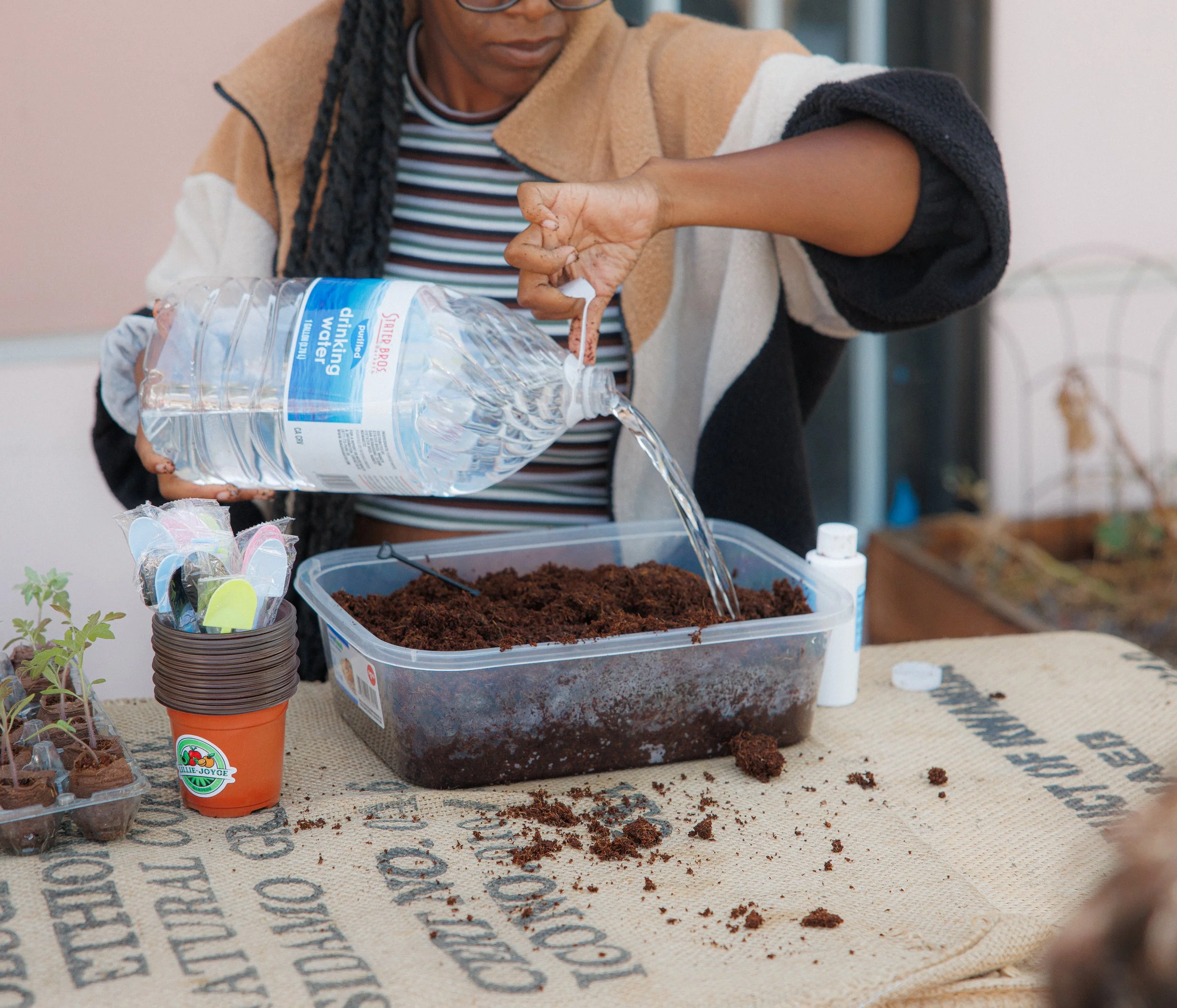 "The Seed", a workshop dedicated to showing people how they can start gardens with limited space. Showcasing that growth happens even in the most humble beginnings. Grow that tomato plant.