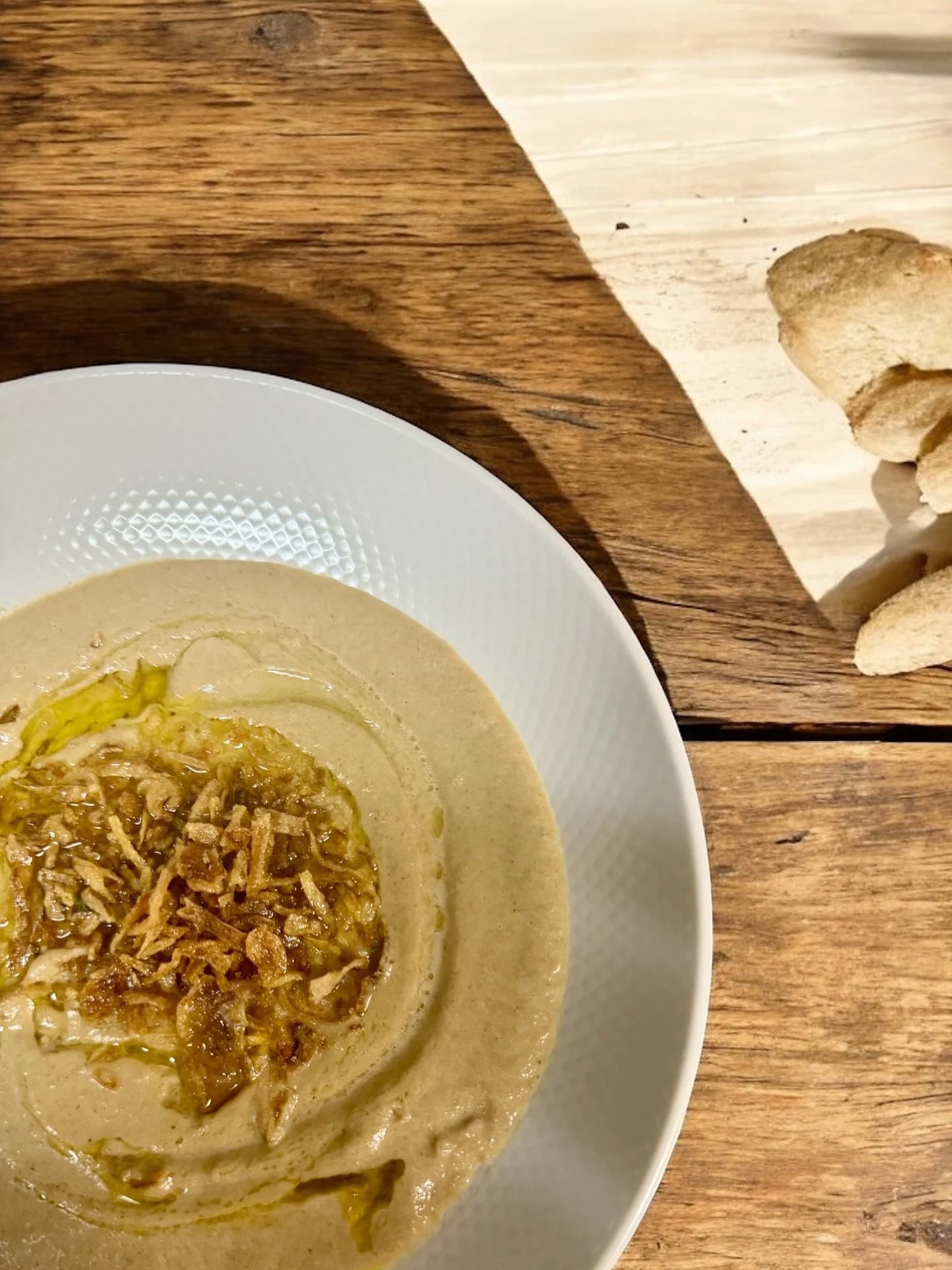 Creamy Mushroom Soup &mdash; the Cedars way.
We blend roasted mushrooms, caramelized onions, and scratch-made vegetable stock (yes, even the scraps get a second life) into pure, velvety comfort.
Finished with a drizzle of olive oil and crispy shallot