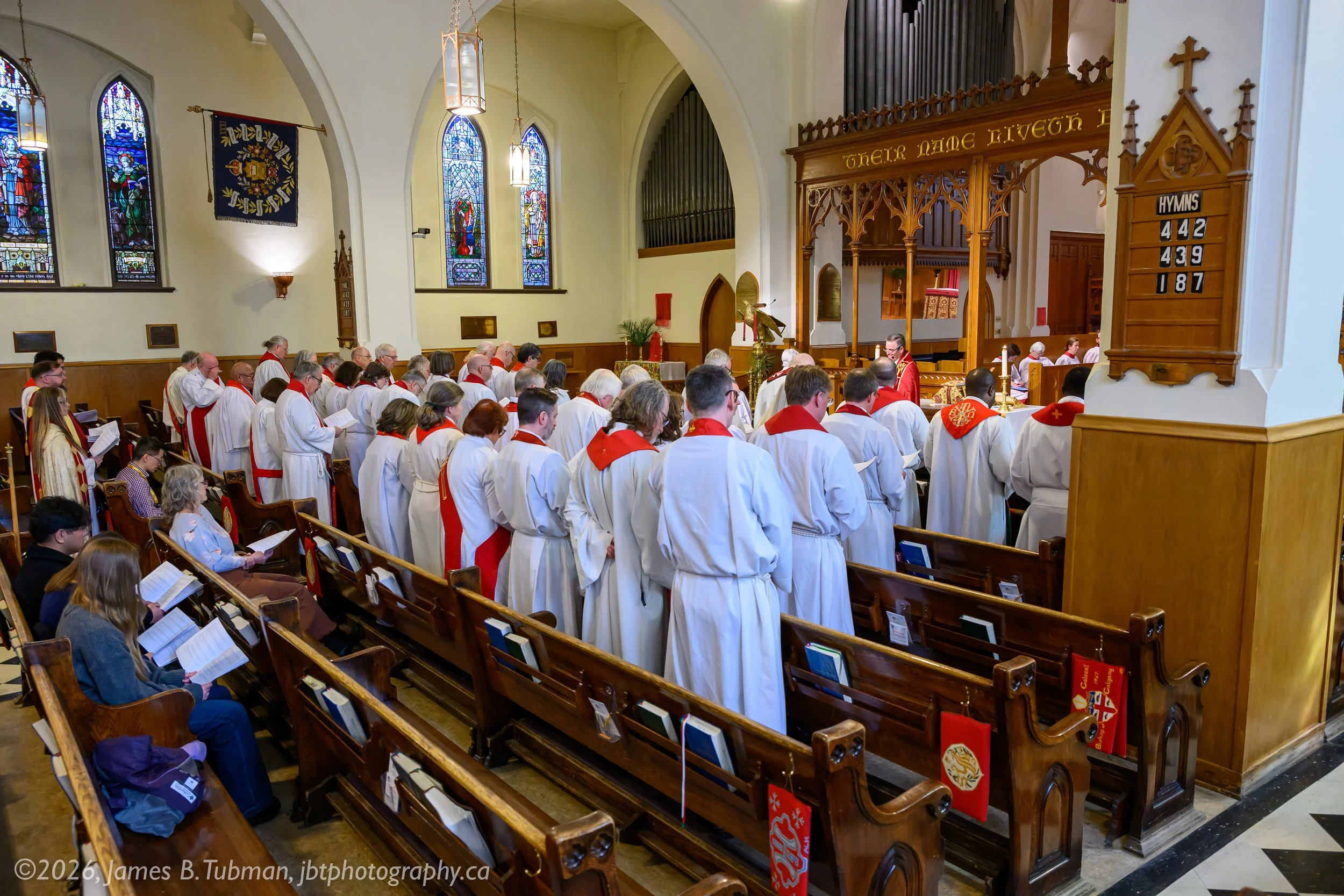 Clergy renewing their ordination vows.