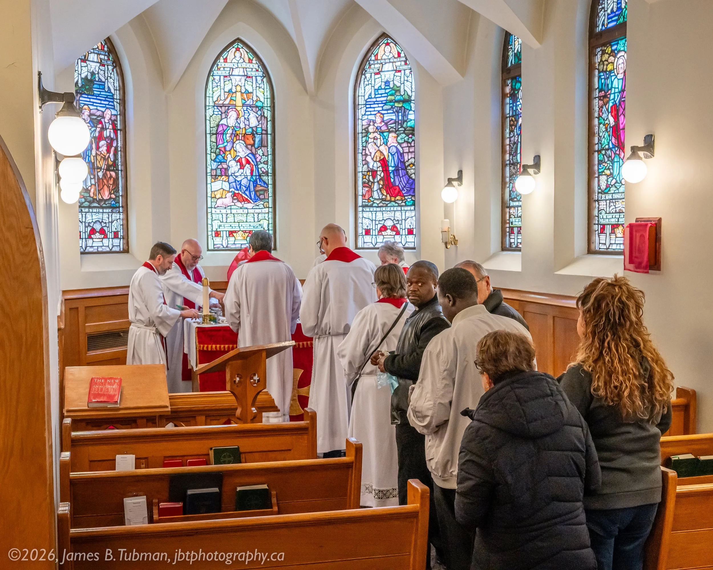 Clergy obtain their supplies of newly blessed oils.