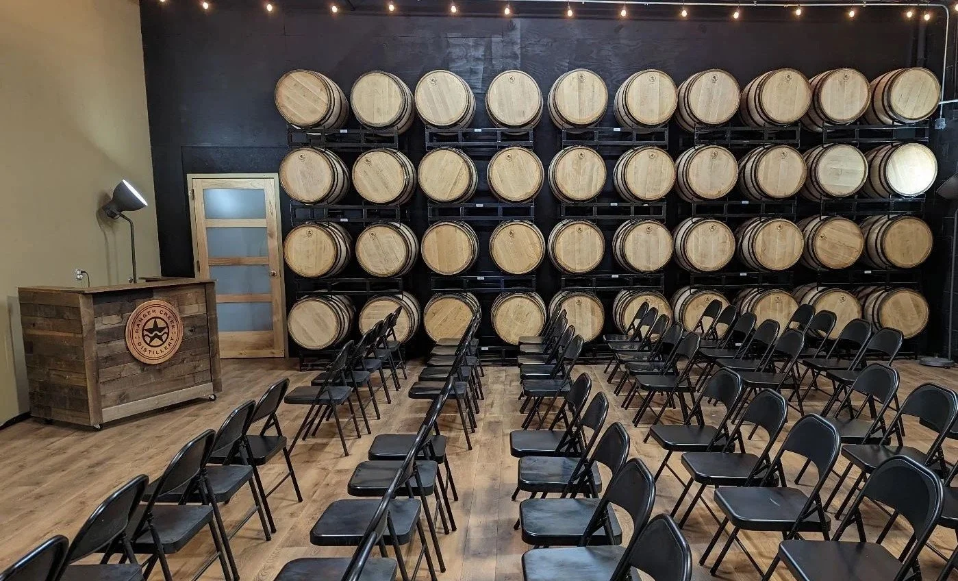Ranger Creek Distilling event space barrel wall.jpg