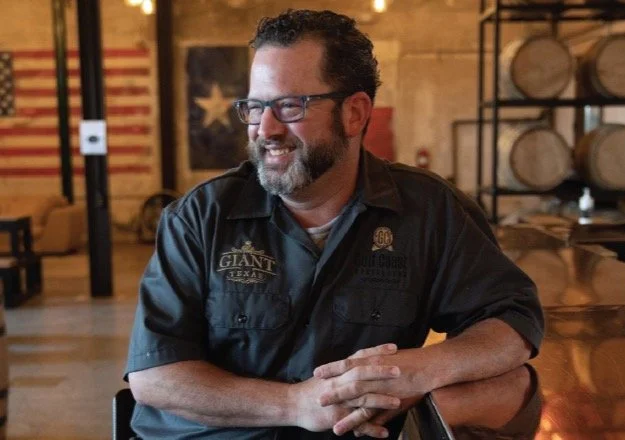 Giant Texas Distillers staff barrel room.jpg
