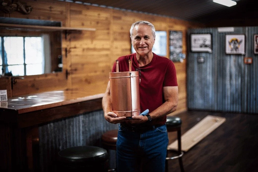 Chapline Distillery Founder Hugging Still.jpg