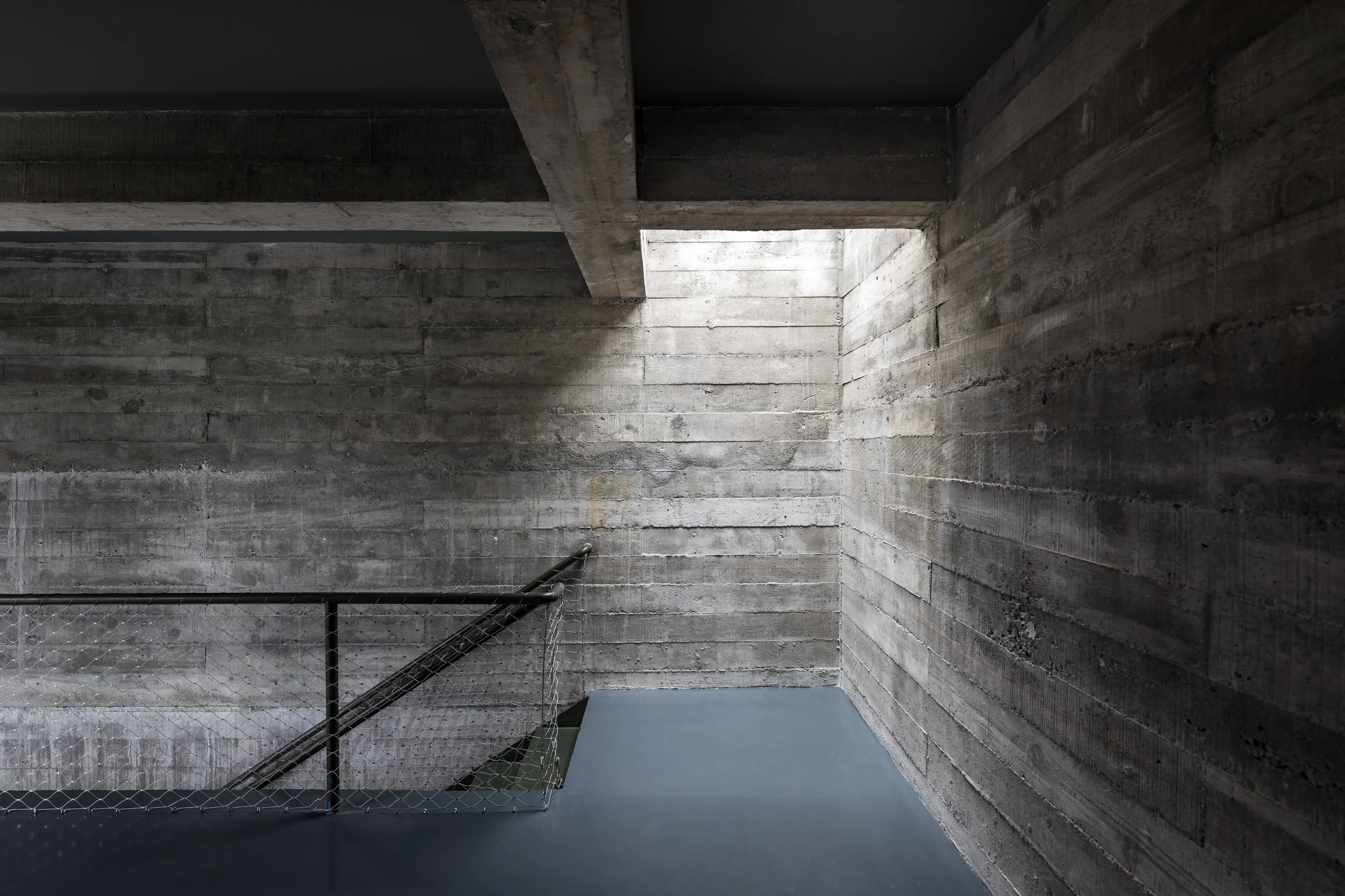 concrete walls illuminated by skylight