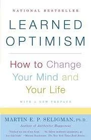 Book cover for "Learned Optimism" by Martin E. P. Seligman, Ph.D., with the subtitle "How to Change Your Mind and Your Life."