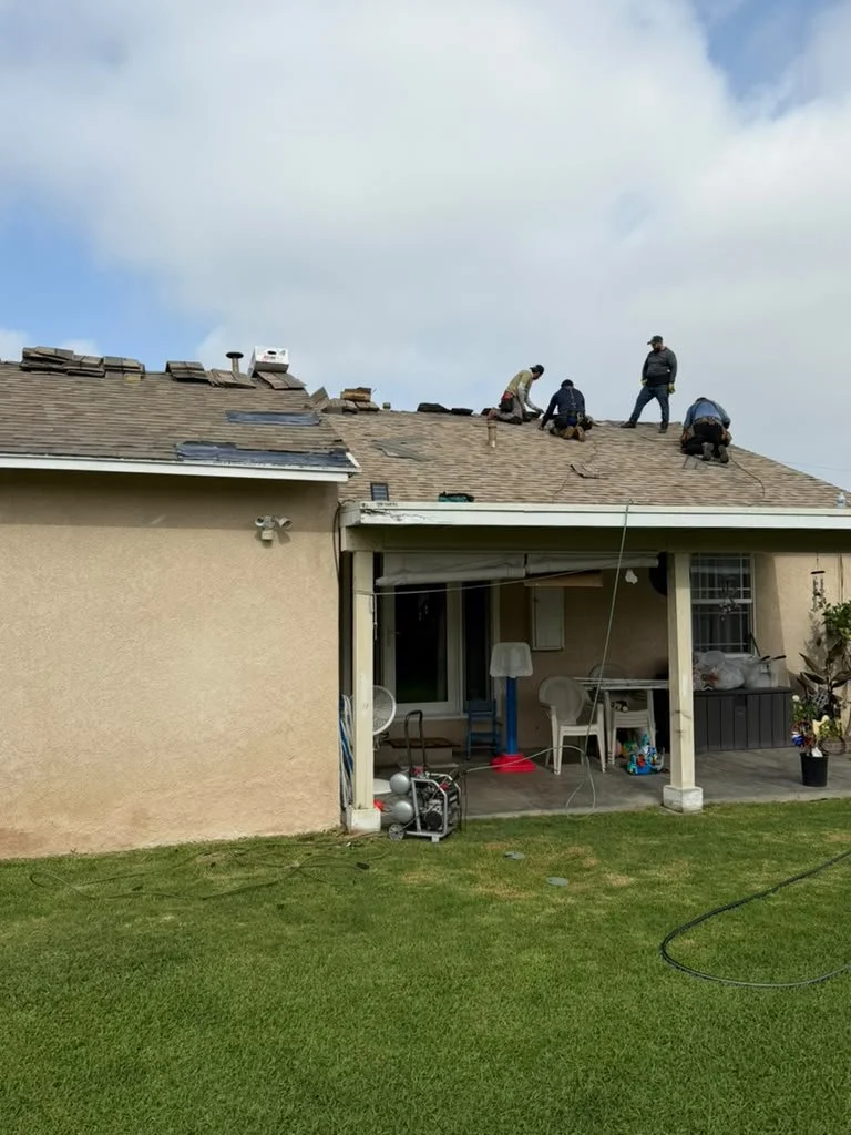 Roofing crew completing a residential roof replacement in Norwalk, CA