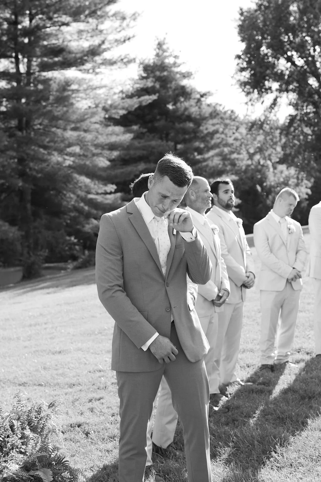 Black and white groom portrait before an outdoor Kentucky wedding ceremony