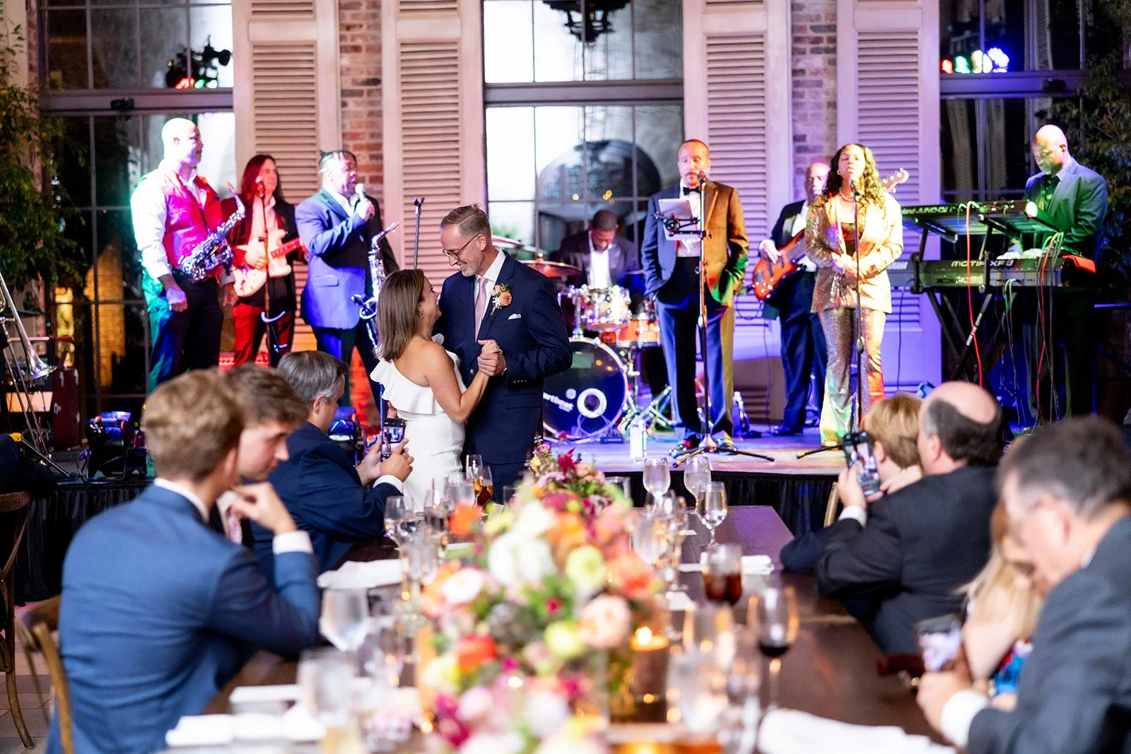 Bride and groom celebrating on the dance floor at The Apiary