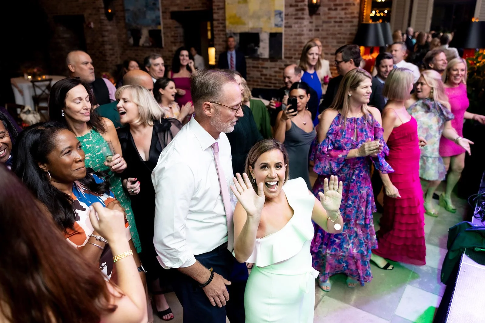 Bride and groom celebrating on the dance floor at The Apiary in Lexington