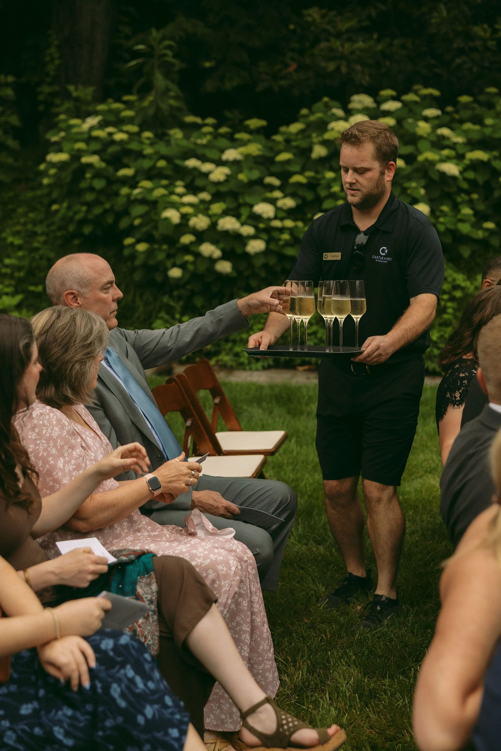 Wedding ceremony surrounded by gardens at Castle & Key