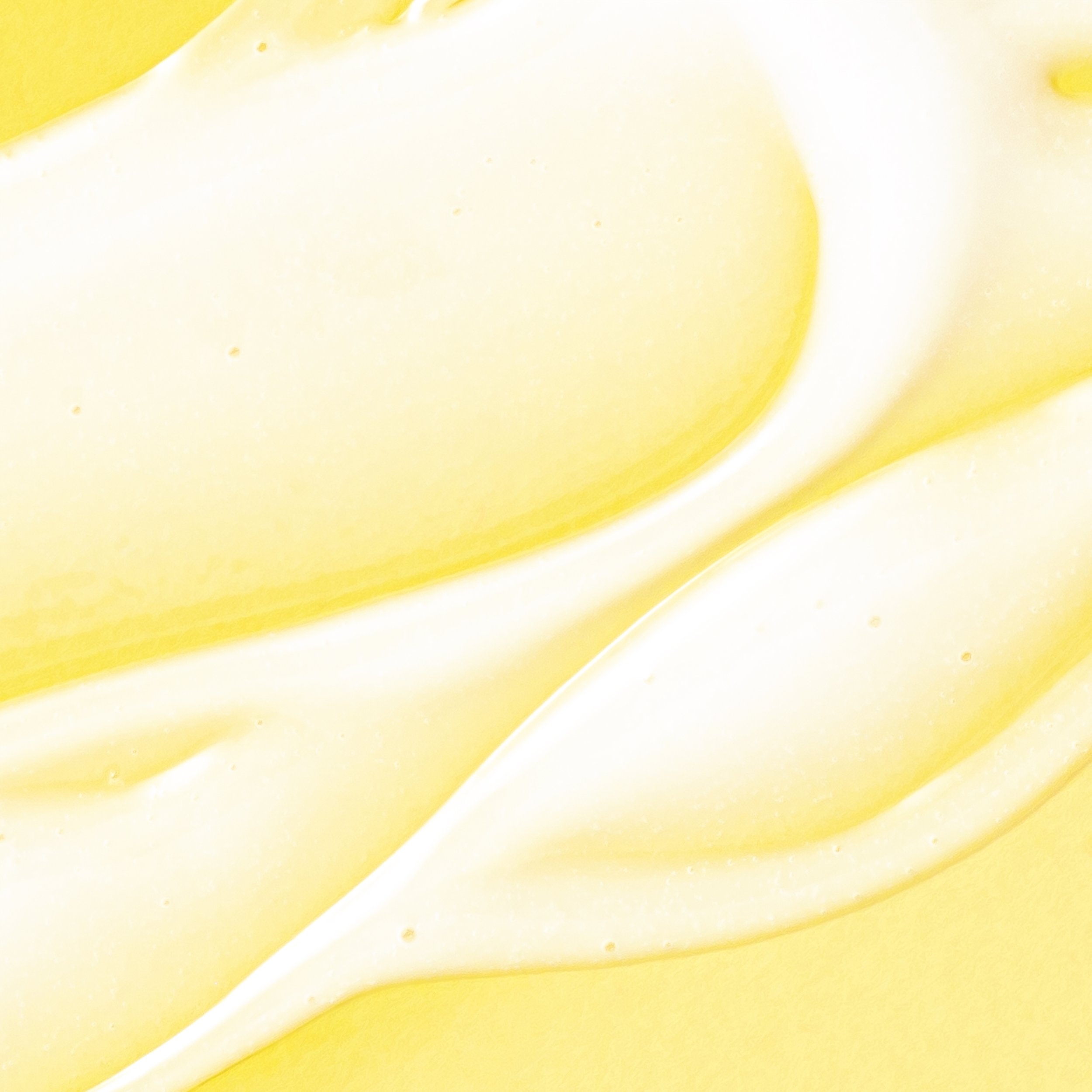 Close-up of creamy yellow liquid texture