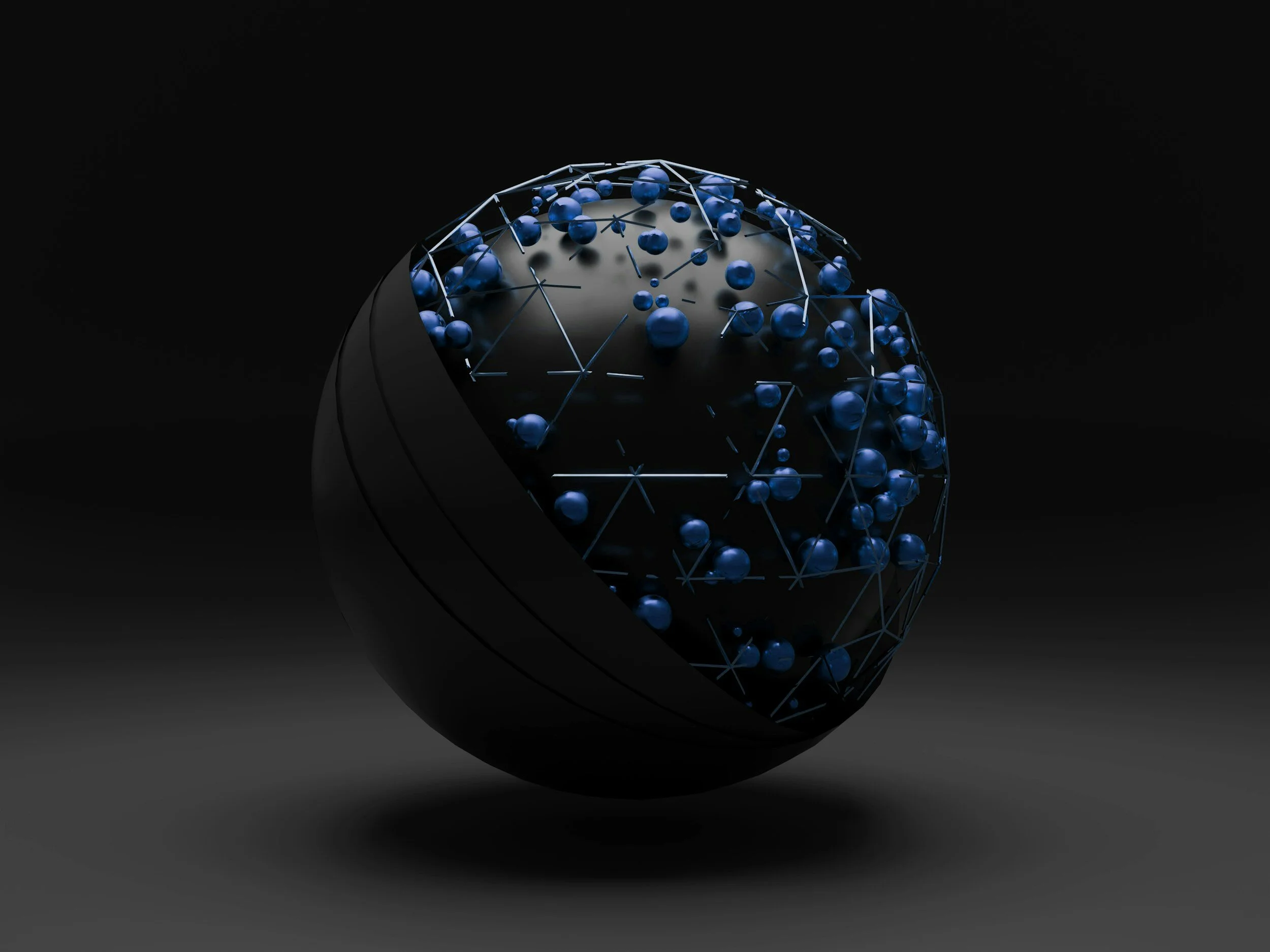 A dark, partially open spherical object reveals a globe-like interior made up of interconnected blue spheres and lines, creating a futuristic, technological appearance.