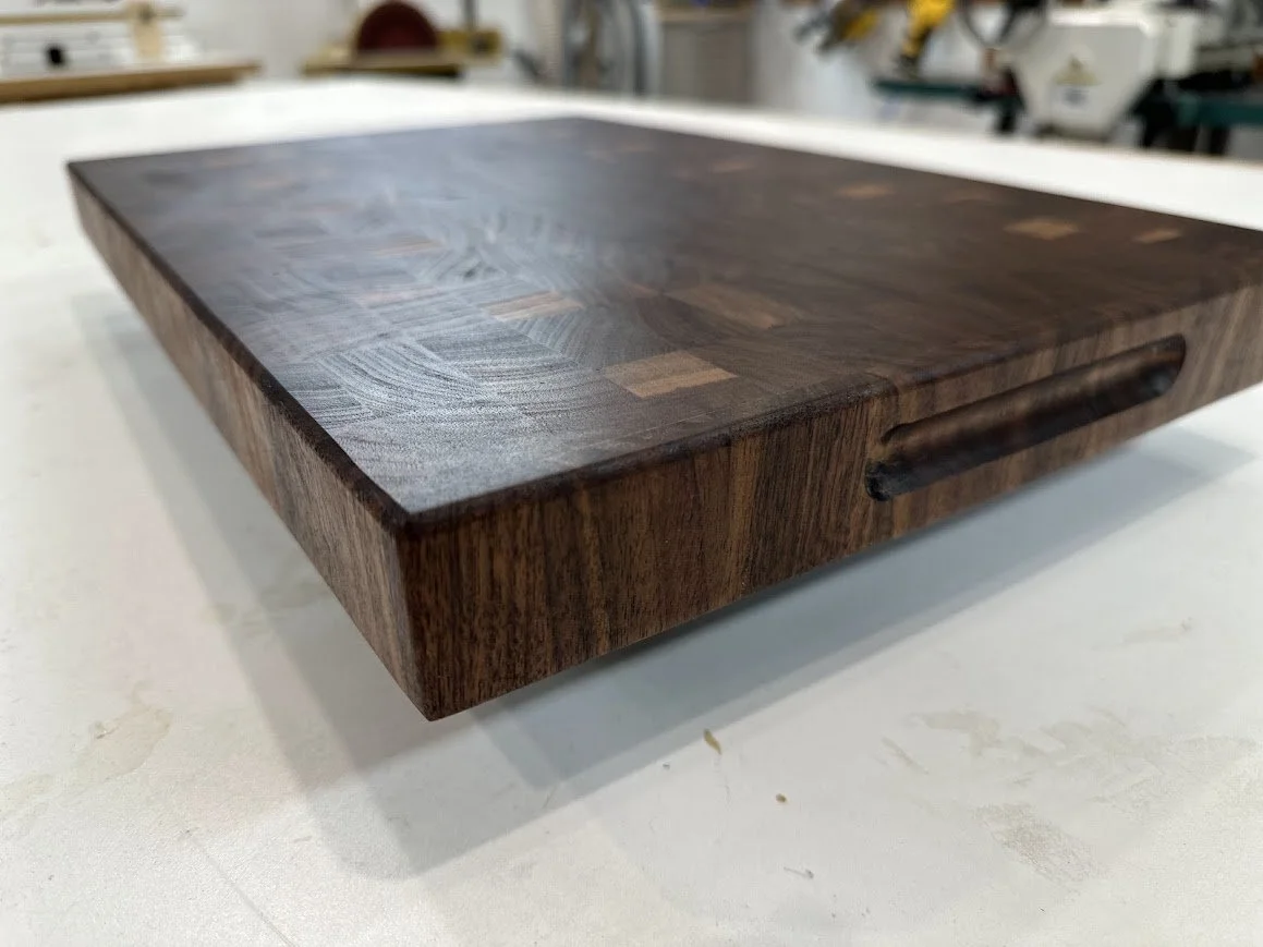 Walnut end grain cutting board with finger groove
