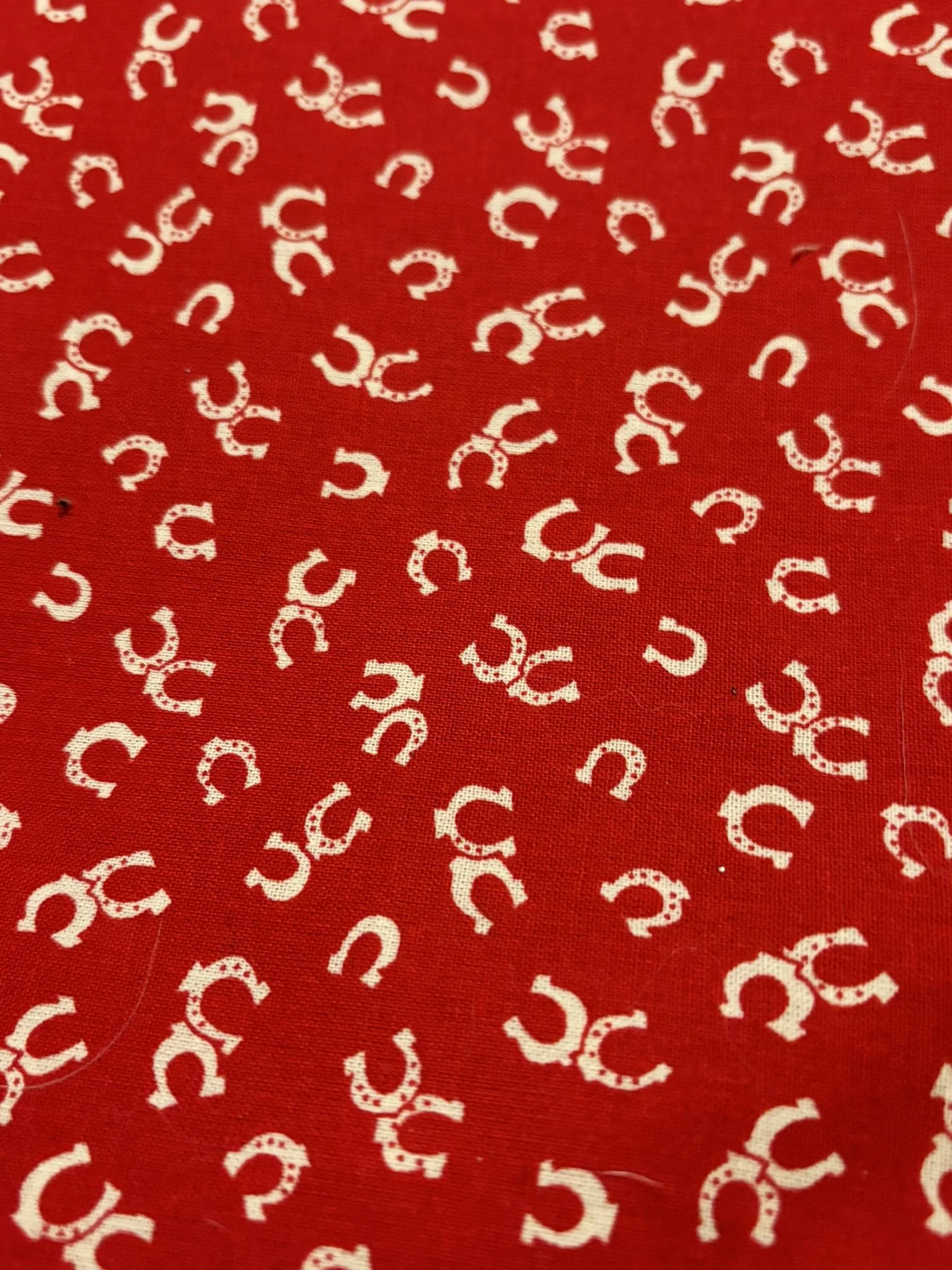 Horseshoes White on Red Cotton