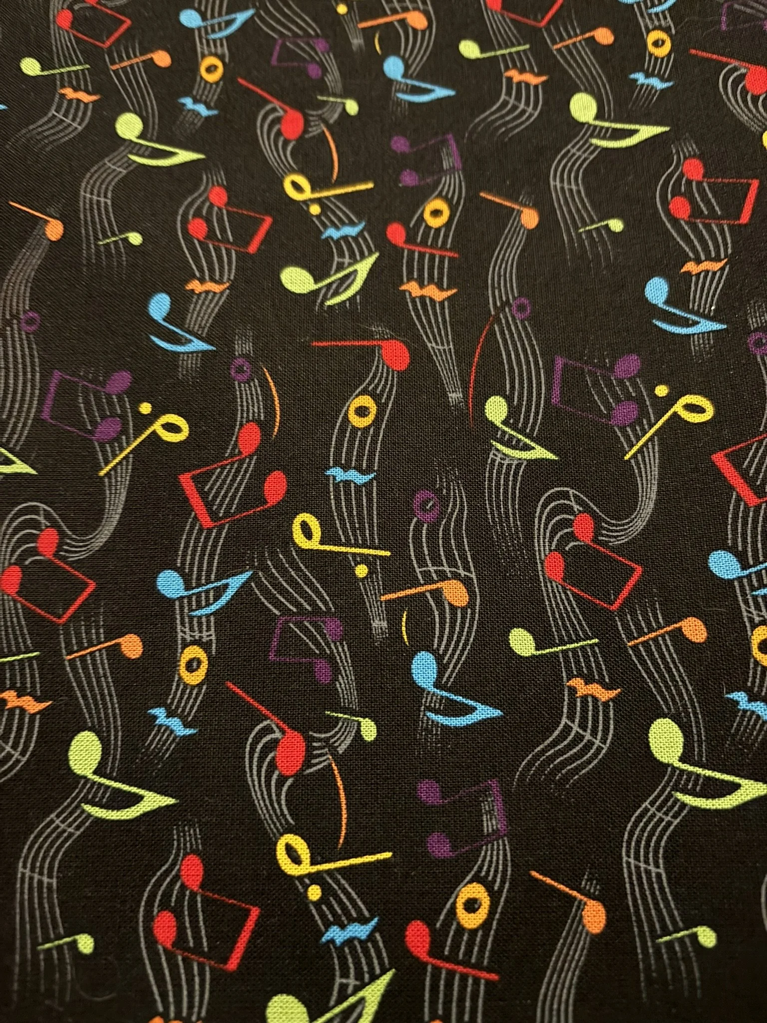 Colored Musical Notes on Black Cotton